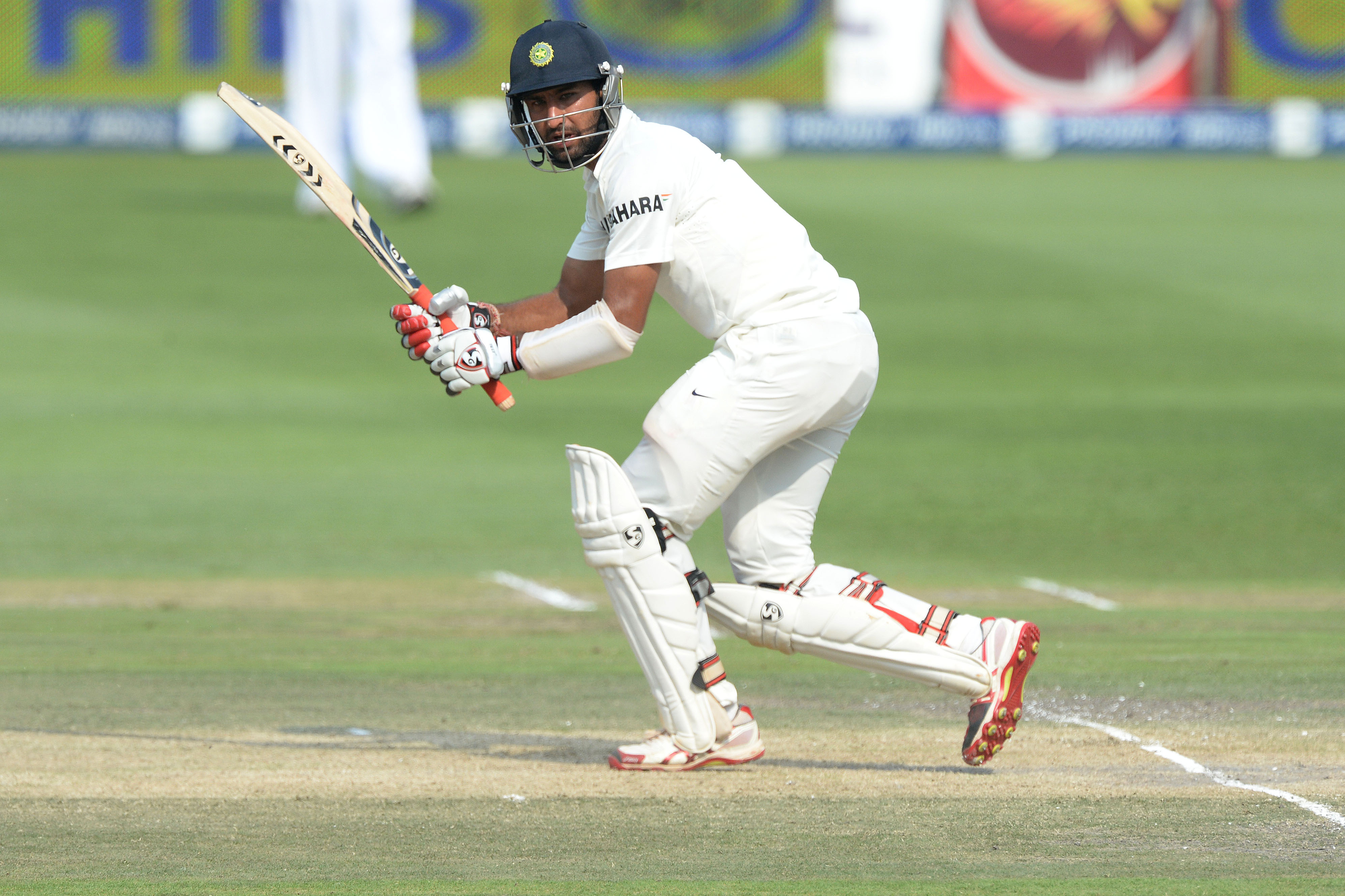 JOHANNESBURG, SOUTH AFRICA - DECEMBER 20: Cheteshwar Pujara plays to square-leg during day 3 of the 1st Test match between South Africa and India at Bidvest Wanderers Stadium on December 20, 2013 in Johannesburg, South Africa. (Photo by Duif du Toit/Gallo Images)