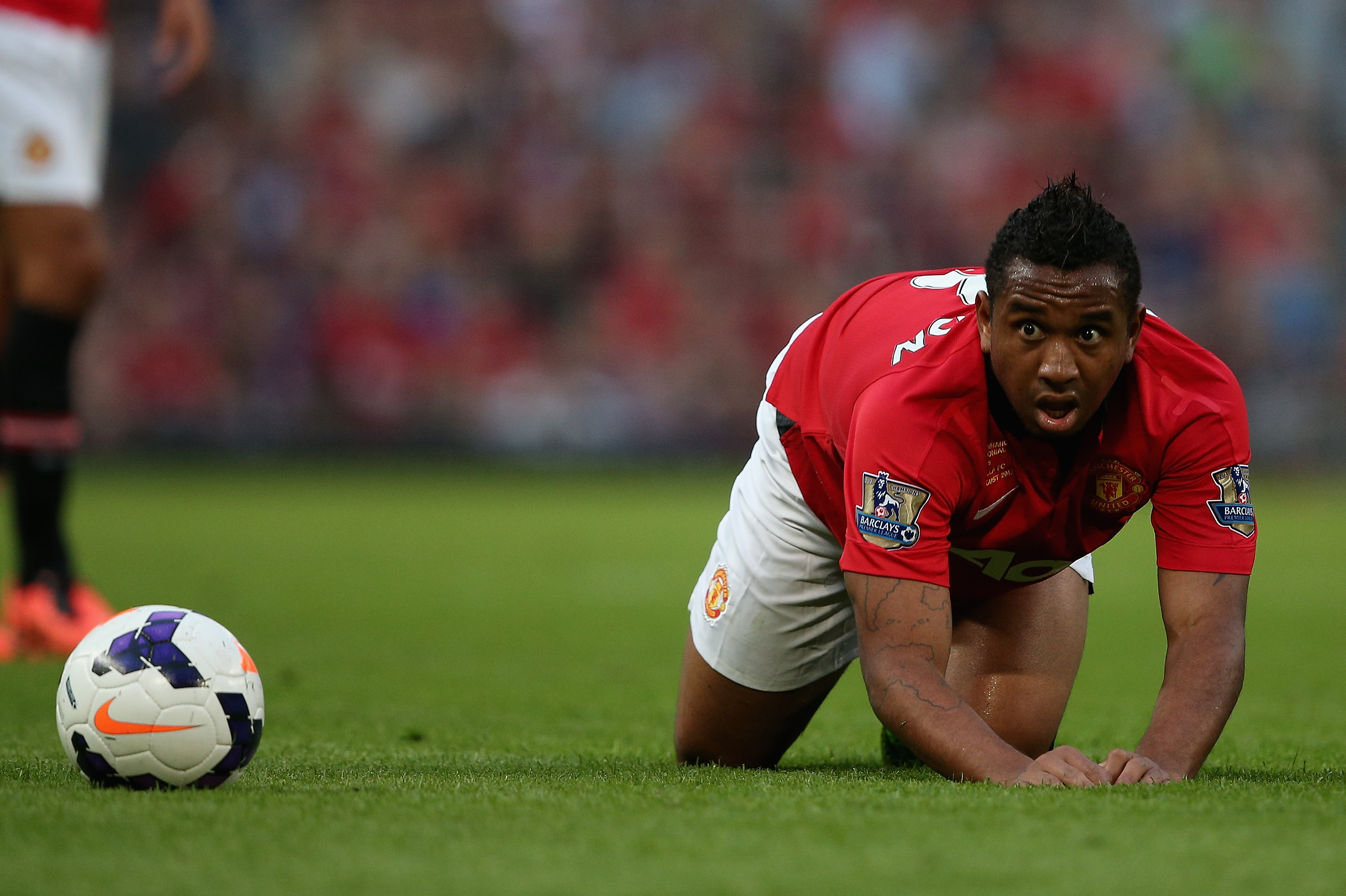 MANCHESTER, ENGLAND - AUGUST 09: Anderson of Manchester United keeps a close eye on the ball during the Rio Ferdinand Testimonial Match between Manchester United and Sevilla at Old Trafford on August 9, 2013 in Manchester, England.  (Photo by Clive Brunskill/Getty Images)