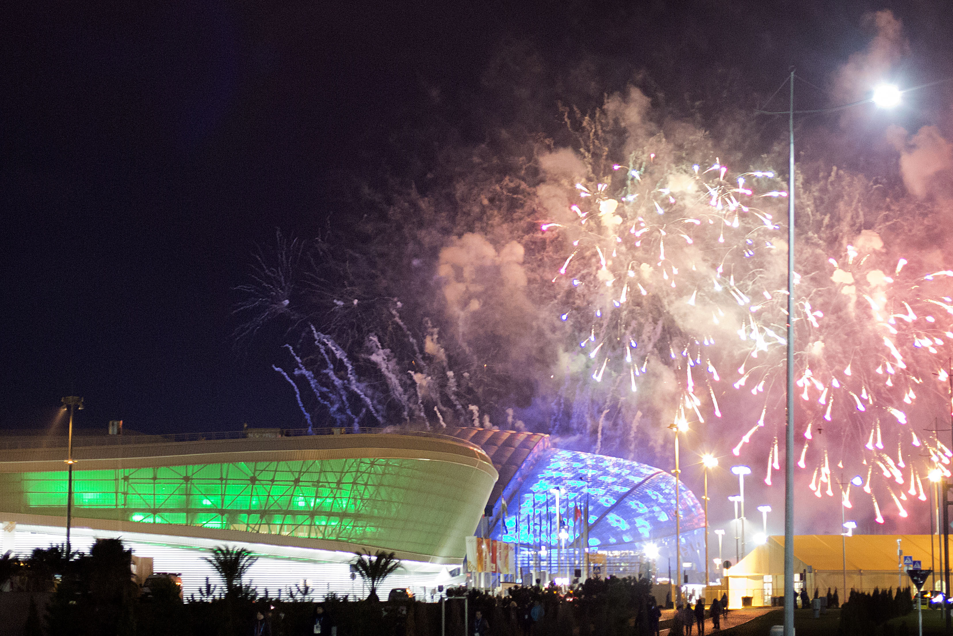 Fireworks are shot over Fisht Olympic Stadium, right, and Adler Arena, left, at the conclusion of a rehearsal for the opening ceremony at the 2014 Winter Olympics, Saturday, Feb. 1, 2014, in Sochi, Russia. (AP Photo/David Goldman)