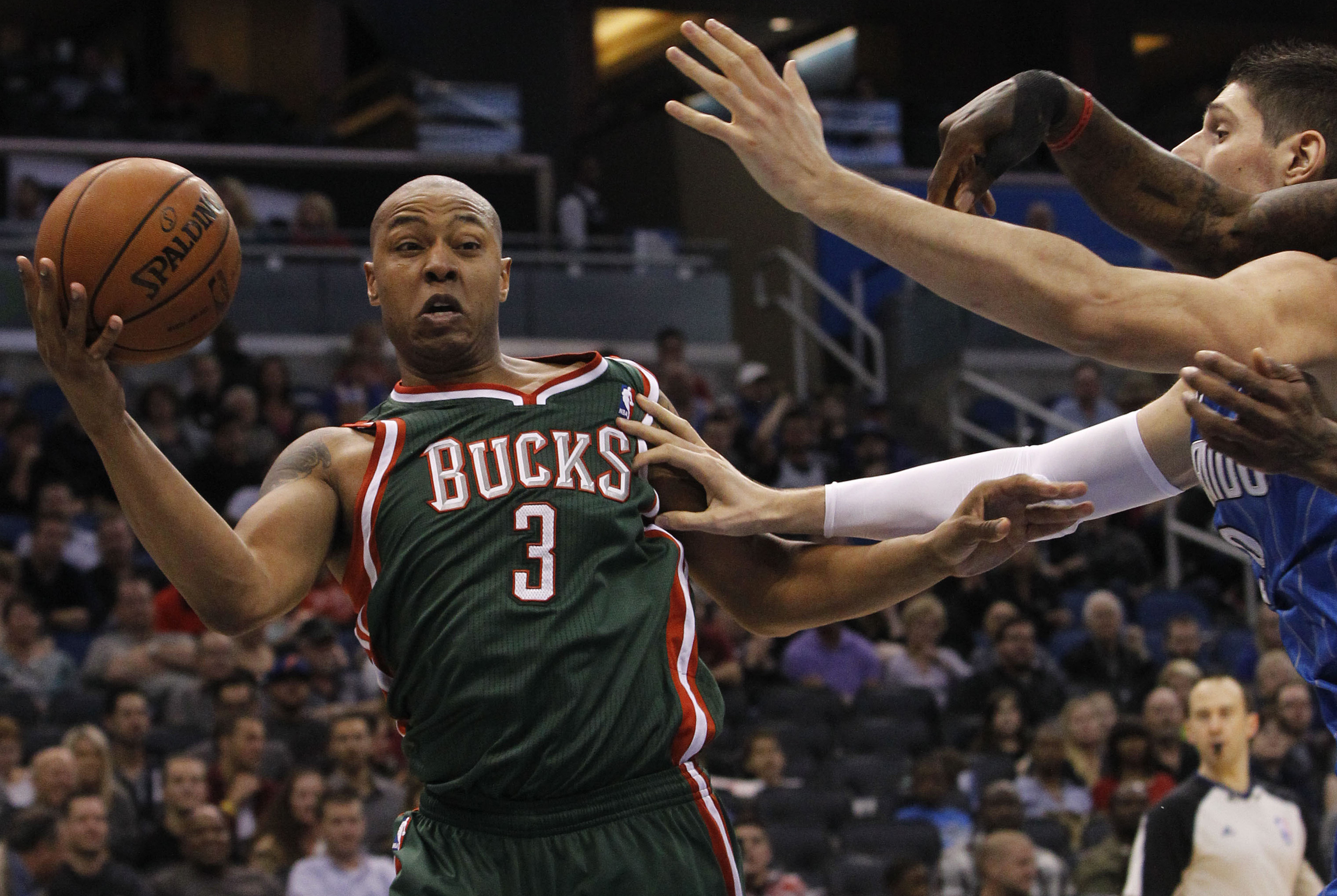 Jan 31, 2014; Orlando, FL, USA; Milwaukee Bucks small forward Caron Butler (3) grabs a rebound against the Orlando Magic during the second half at Amway Center. Orlando Magic won 113-102.  Mandatory Credit: Kim Klement-USA TODAY Sports