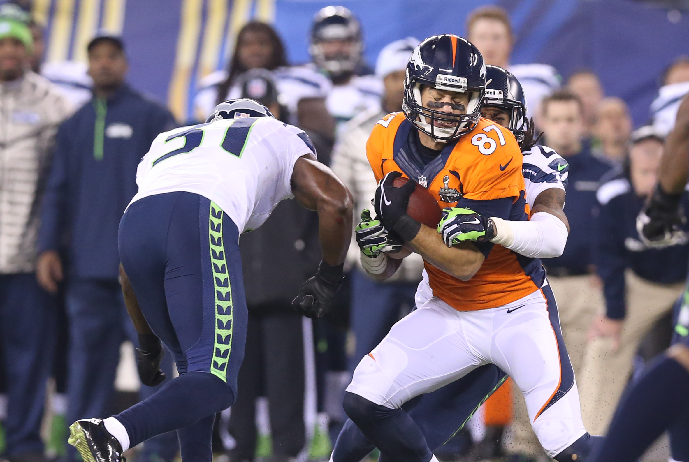 Feb 2, 2014; East Rutherford, NJ, USA; Seattle Seahawks cornerback Richard Sherman (25) and Kam Chancellor (31) tackle Denver Broncos receiver Eric Decker (87) after a reception during the third quarter in Super Bowl XLVIII at MetLife Stadium.Mandatory Credit: Matthew Emmons-USA TODAY Sports