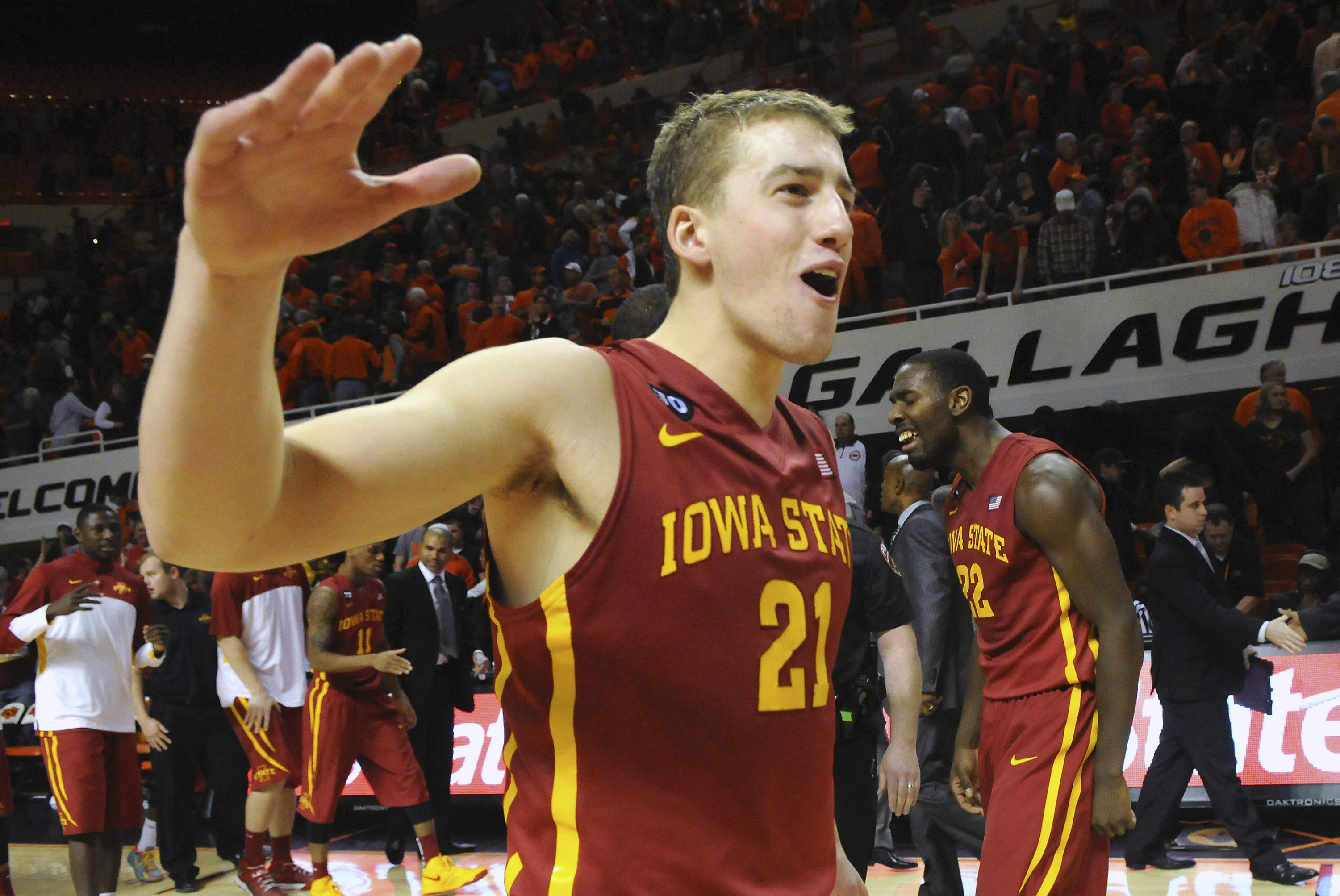 Iowa State center Matt Thomas celebrates with teammates following a triple overtime win in an NCAA college basketball game in Stillwater, Okla., Monday, Feb. 3, 2014. Thomas scored 6 points in Iowa State's 98-97 win. (AP Photo/Brody Schmidt)