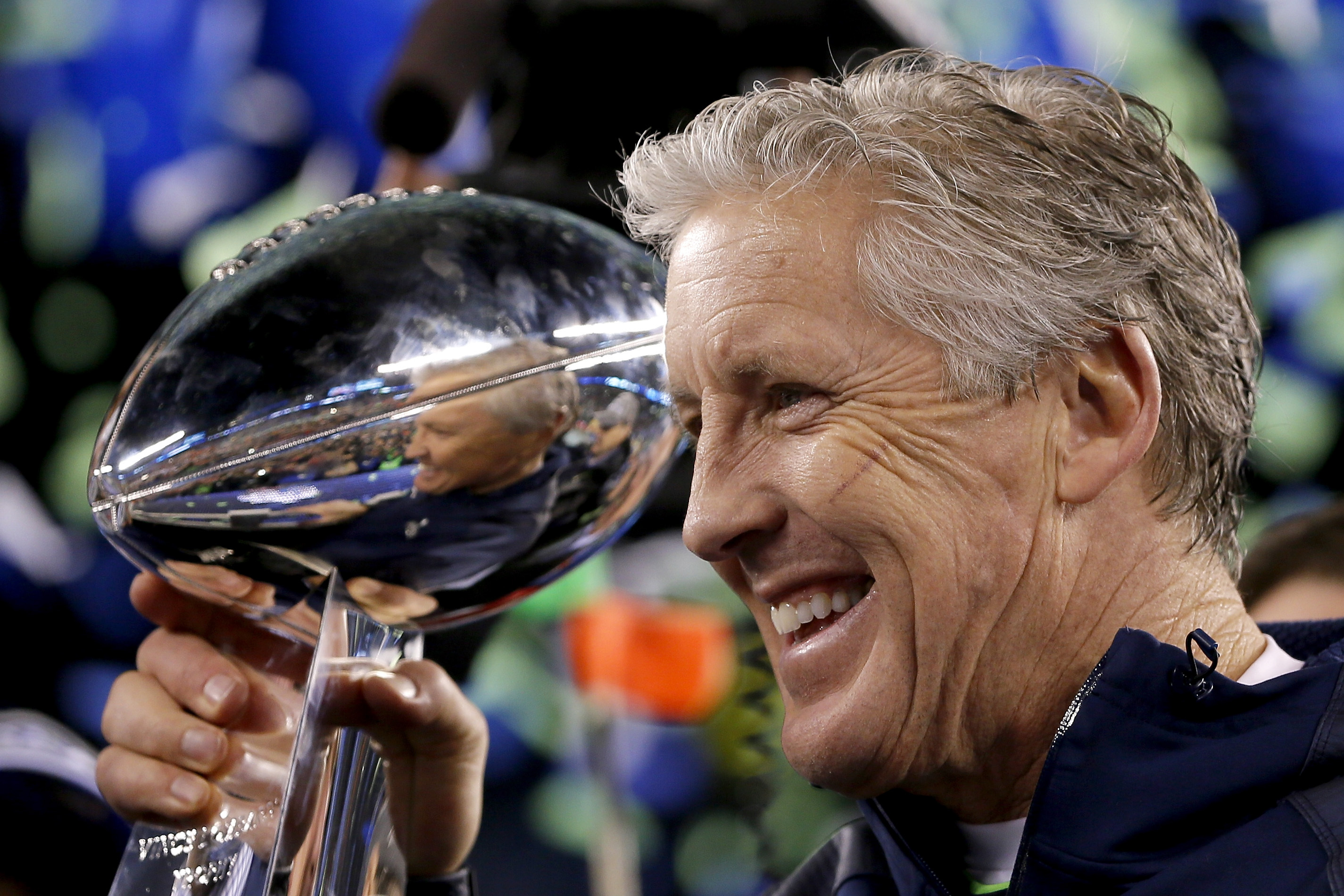 EAST RUTHERFORD, NJ - FEBRUARY 02:  Head coach Pete Carroll of the Seattle Seahawks celebrates with the Vince Lombardi Trophy after their 43-8 victory over the Denver Broncos during Super Bowl XLVIII at MetLife Stadium on February 2, 2014 in East Rutherford, New Jersey.  (Photo by Kevin C. Cox/Getty Images)