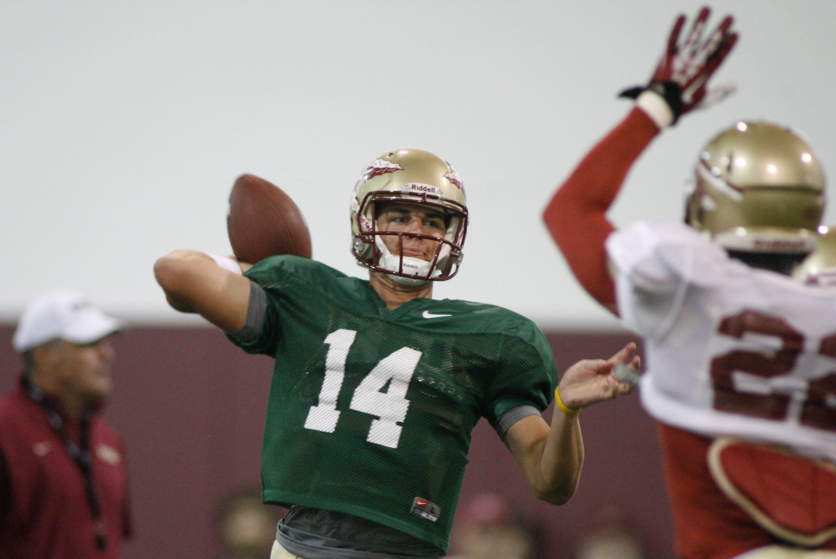 Florida State quarterback Jacob Coker (14) gets off a pass as he is pressured by linebacker Telvin Smith (22) during an afternoon practice at their indoor training facility following their NCAA college football media day on Sunday, Aug. 11, 2013, in Tallahassee, Fla. (AP Photo/Phil Sears)