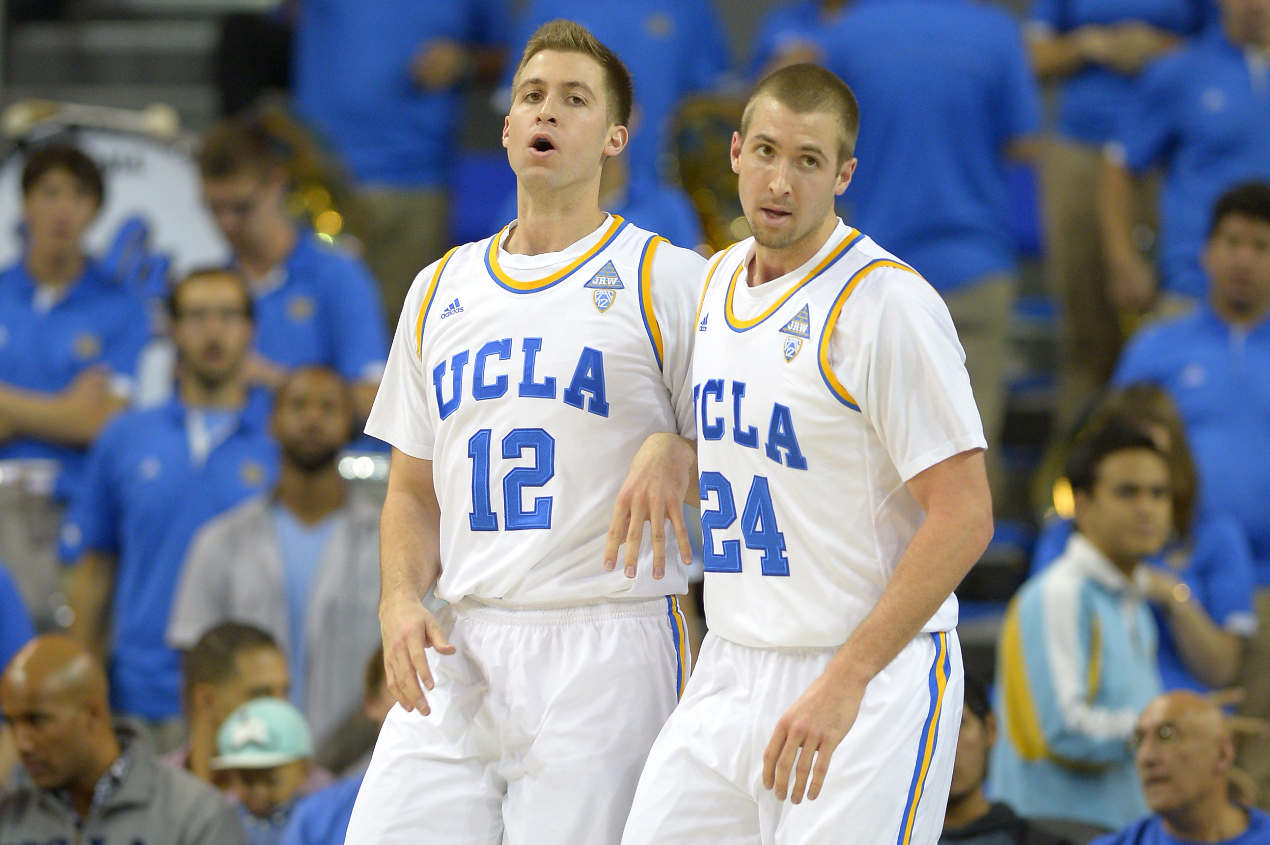UCLA forward David Wear, left, and forward Travis Wear stand together during the first half of an NCAA college basketball game against Prairie View, Saturday, Dec. 14, 2013, in Los Angeles. (AP Photo/Mark J. Terrill)