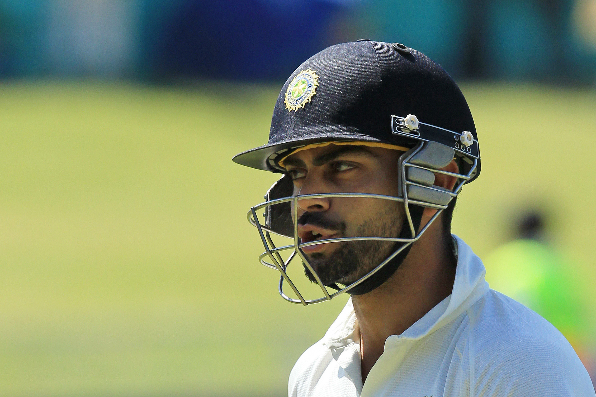 India's batsman Virat Kohli talks to himself as he walks back to the players pavilion after being dismissed for 11 runs on the firth and final day of their cricket test match against South Africa at Kingsmead Stadium in Durban, South Africa, Monday, Dec. 30, 2013. (AP Photo/Themba Hadebe)