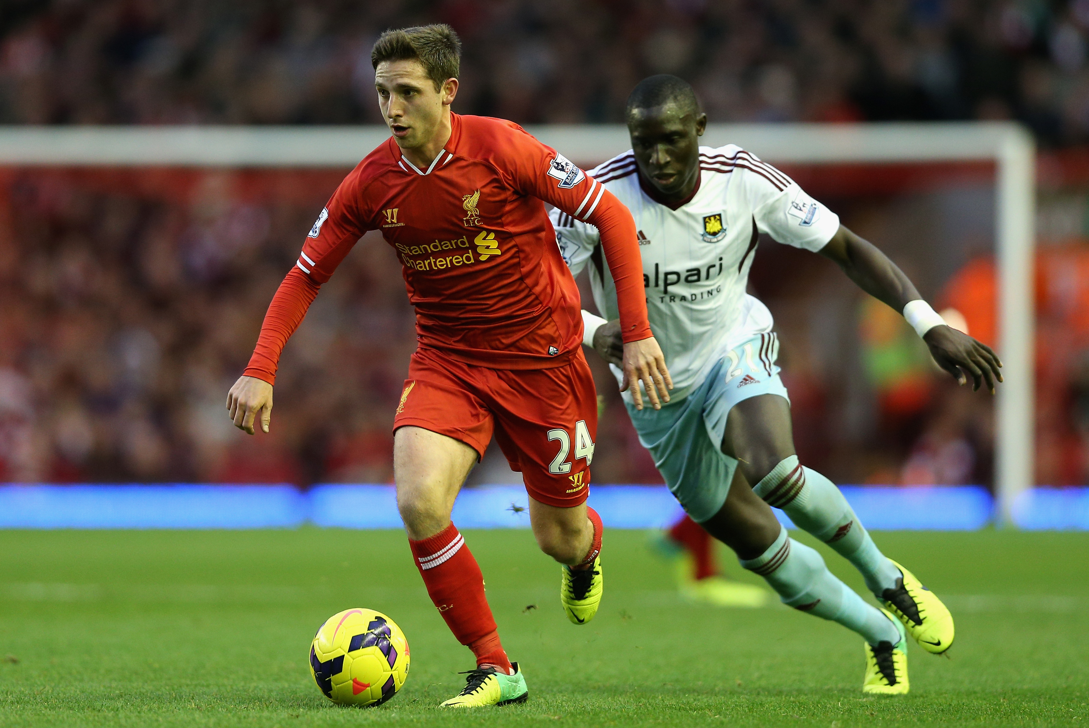 LIVERPOOL, ENGLAND - DECEMBER 07:  Joe Allen of Liverpool competes with Mohamed Diame of West Ham United during the Barclays Premier League match between Liverpool and West Ham United at Anfield on December 7, 2013 in Liverpool, England.  (Photo by Clive Brunskill/Getty Images)
