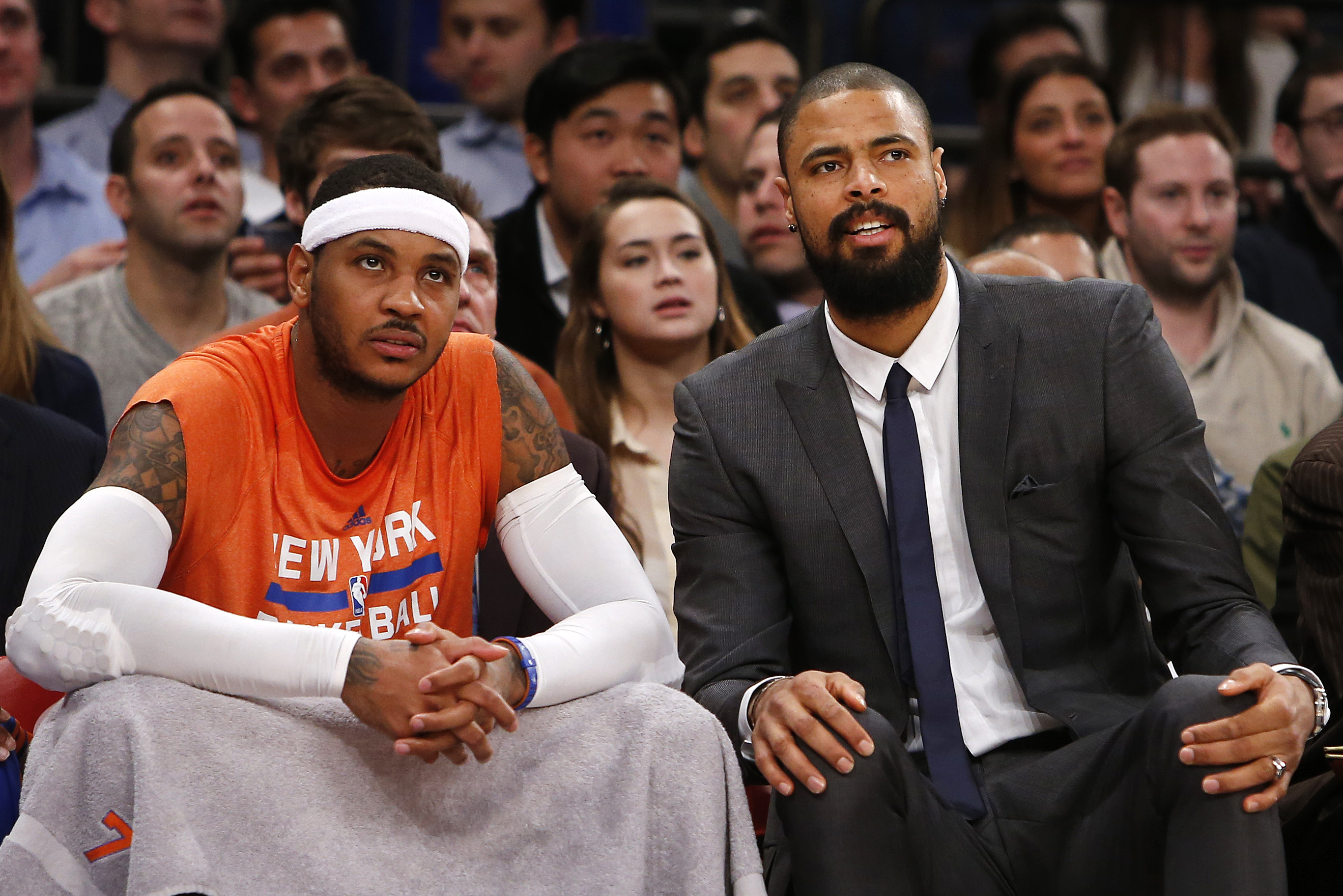 New York Knicks' Carmelo Anthony, left, sits on the bench with teammate Tyson Chandler in the second half of an NBA basketball game against the Washington Wizards Monday, Dec. 16, 2013, in New York.  The Wizards won 102-101. (AP Photo/Jason DeCrow)
