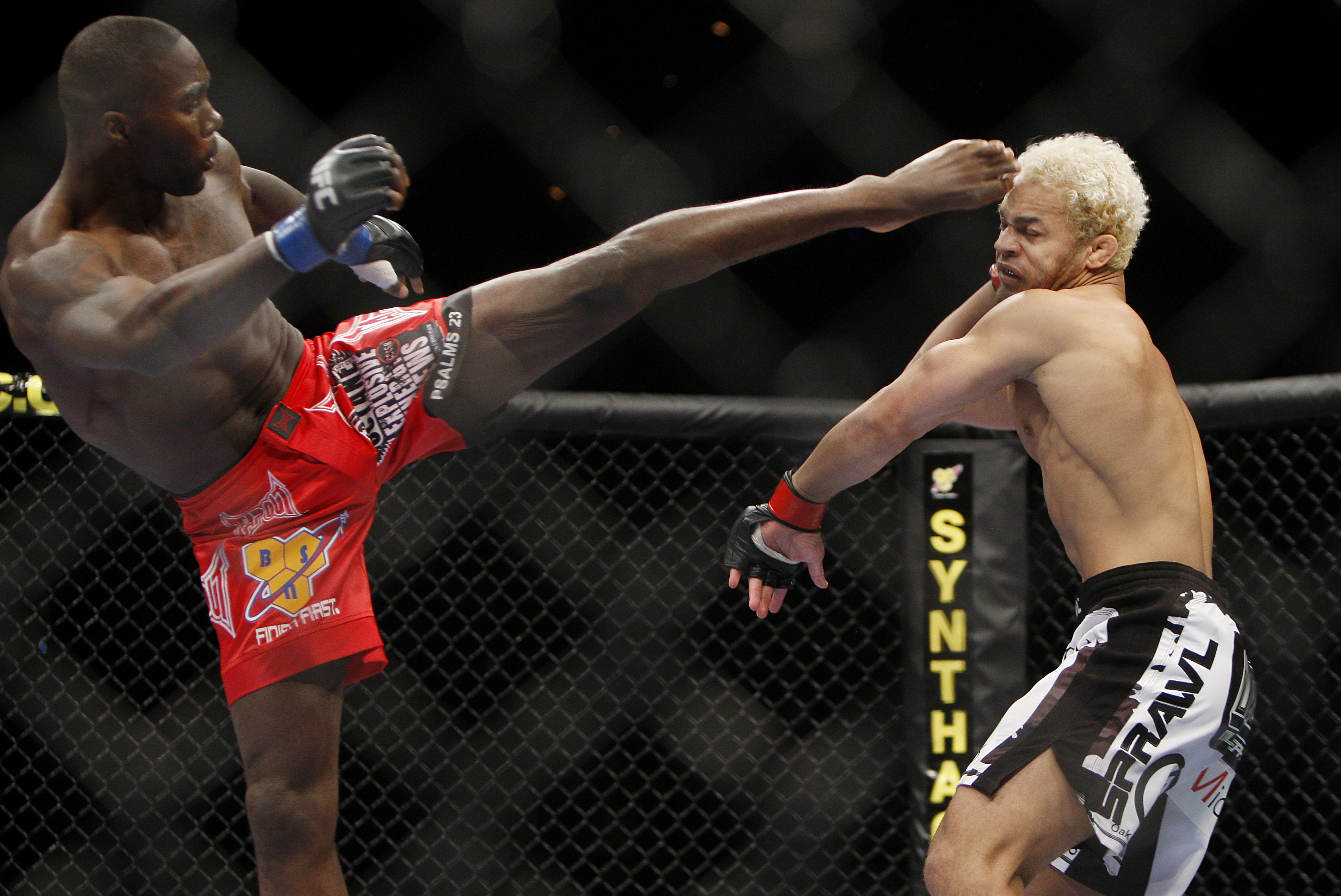 Anthony Johnson, left, kicks Josh Koscheck during their mixed martial arts welterweight bout, Saturday, Nov. 21, 2009, in Las Vegas. (AP Photo/Isaac Brekken)