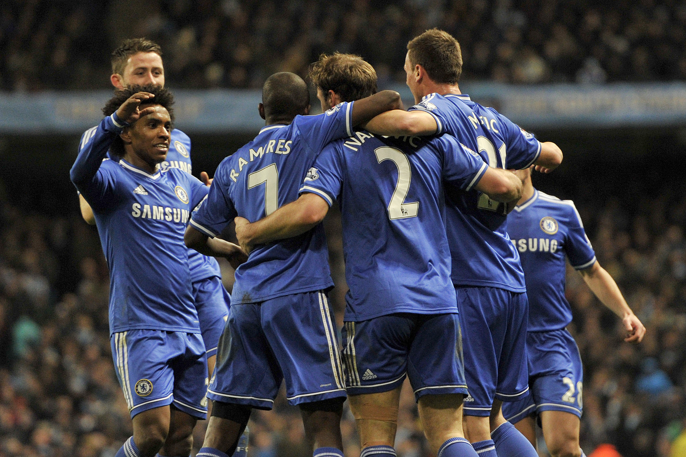 Chelsea's Branislav Ivanovic, third left, celebrates with his team-mates after he scored the first goal of the game for his side during their English Premier League soccer match against Manchester City at the Etihad stadium in Manchester, England, Monday Feb. 3, 2014. (AP Photo/Clint Hughes)