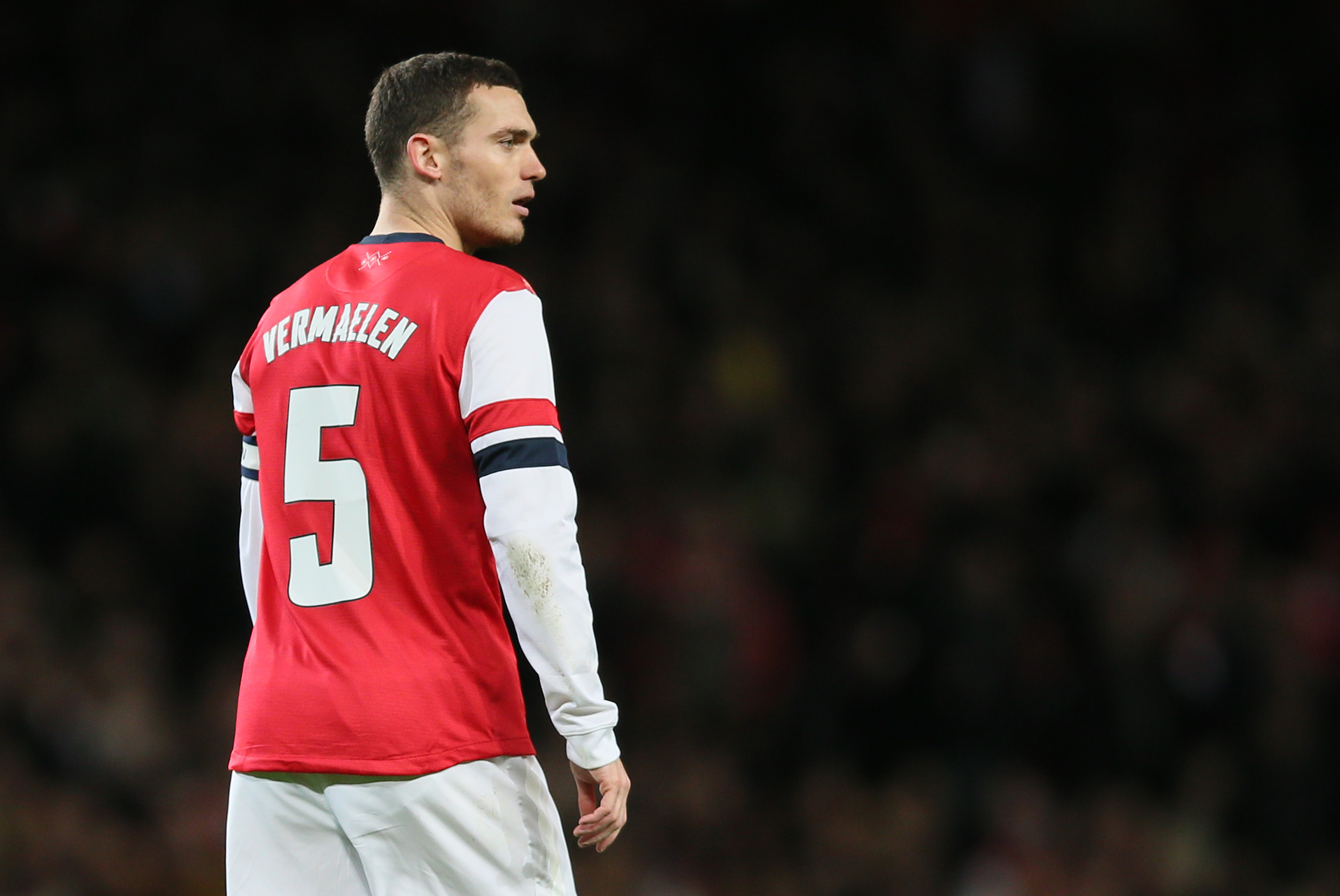 Arsenal's Thomas Vermaelen looks to his right as he watches his teammates during their English League Cup soccer match between Arsenal and Chelsea at the Emirates stadium in London Tuesday, Oct. 29, 2013. (AP Photo/Alastair Grant)