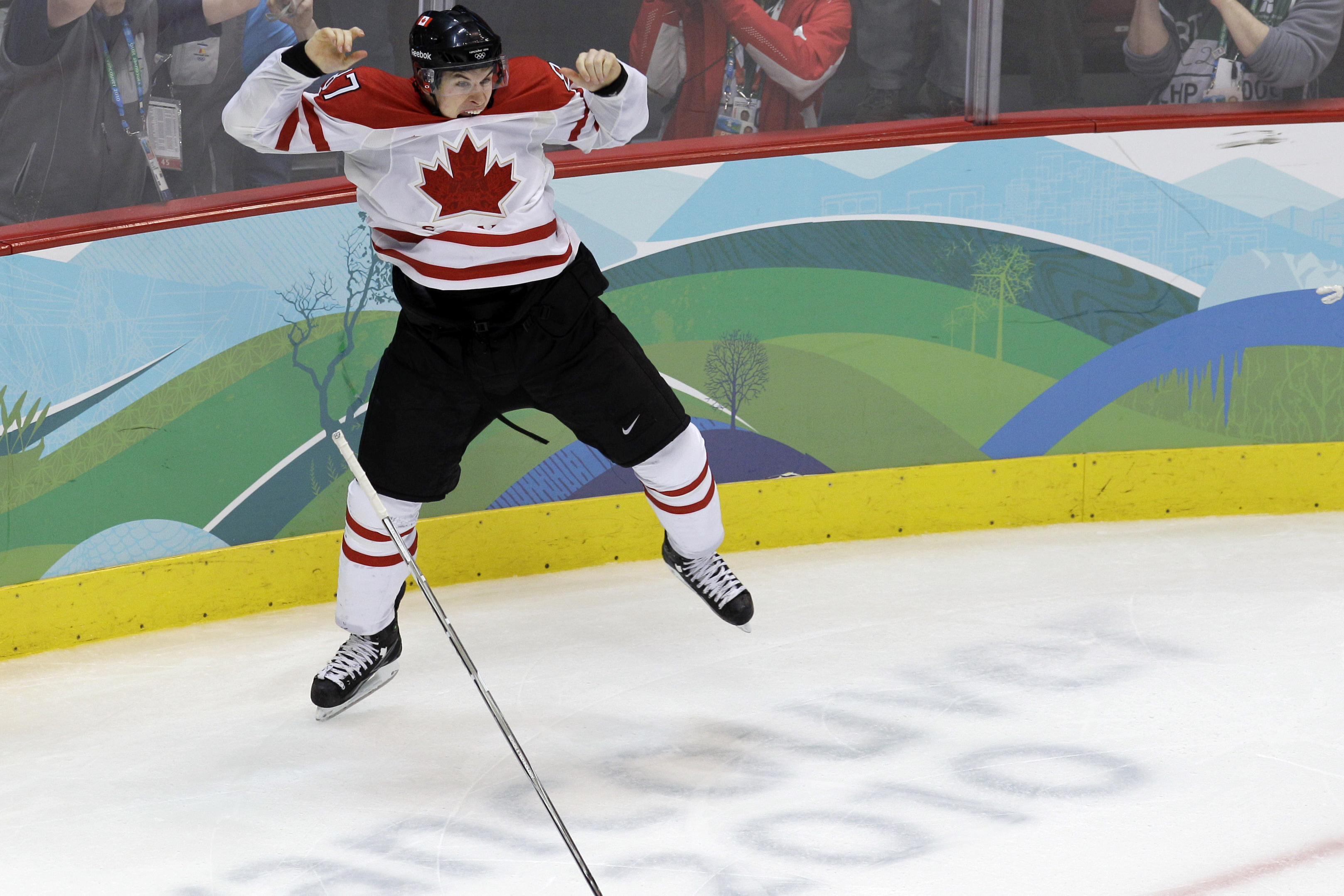 FILE - In this Feb. 28, 2010, file photo, Canada's Sidney Crosby leaps in the air after scoriung the game-winning goal in the overtime period of the men's gold medal ice hockey game against team USA at the Vancouver 2010 Olympics in Vancouver, British Columbia. Hockey Canada announced its 25-man hockey roster, loaded with NHL stars,  for the Winter Olympics on Tuesday, Jan. 7, 2014, and Sid the Kid is going to have plenty of help. Joining Crosby, who scored the gold-medal winning goal in 2010 against the U.S., will be Jamie Benn, Patrice Bergeron, Jeff Carter, Matt Duchene, Ryan Getzlaf, Chris Kunitz, Patrick Marleau, Rick Nash, Corey Perry, Patrick Sharp, Steven Stamkos, John Tavares and Jonathan Toews. (AP Photo/Chris O'Meara, File)