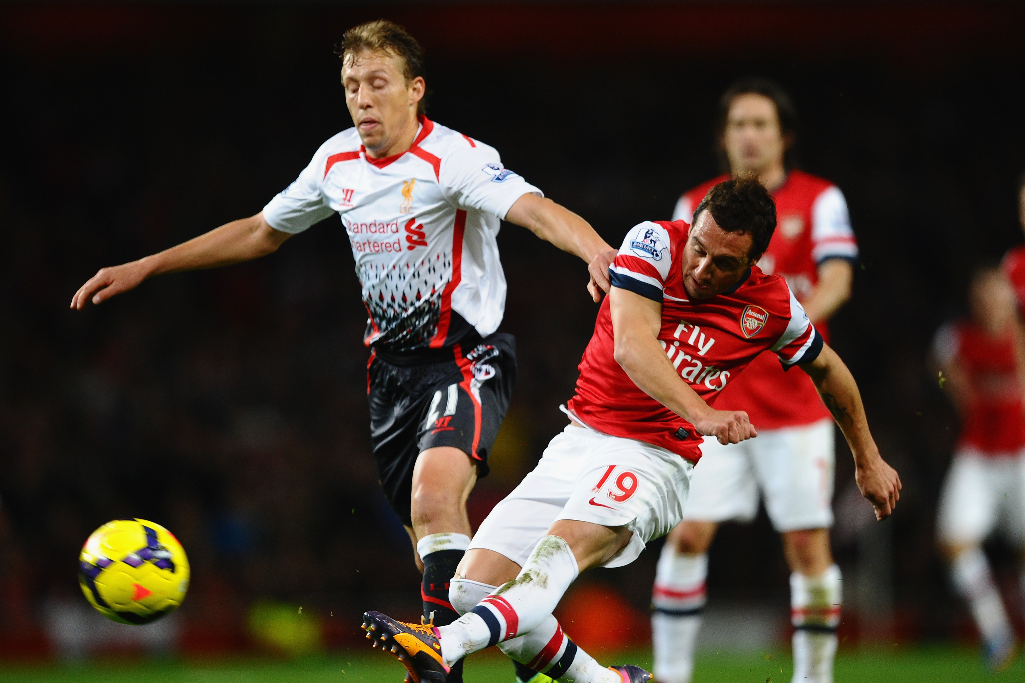 LONDON, ENGLAND - NOVEMBER 02:  Lucas Leiva of Liverpool and Santi Cazorla of Arsenal battle for the ball during the Barclays Premier League match between Arsenal and Liverpool at Emirates Stadium on November 2, 2013 in London, England.  (Photo by Laurence Griffiths/Getty Images)