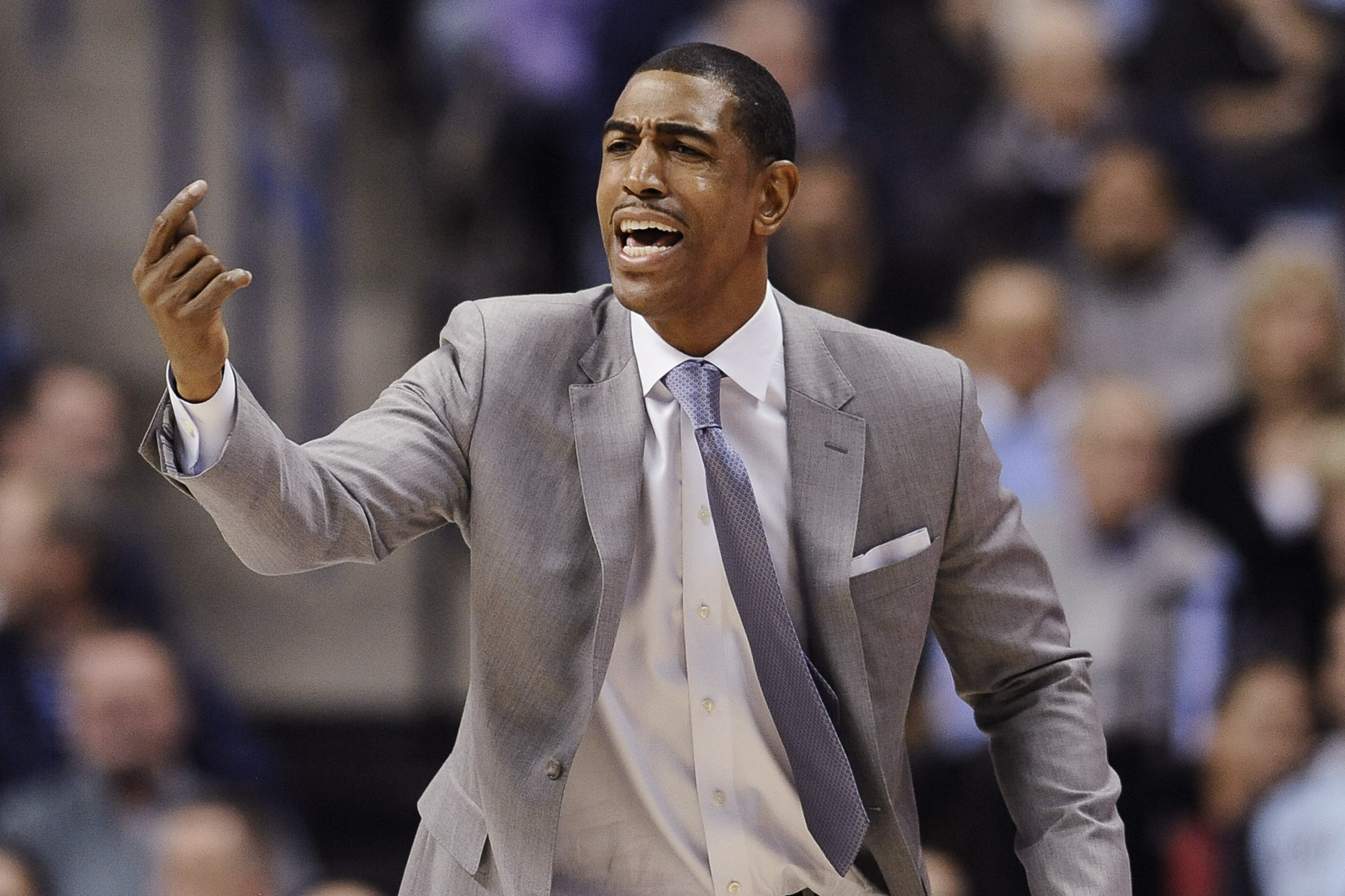 Connecticut head coach Kevin Ollie reacts during the first half of an NCAA college basketball game against Florida, Monday, Dec. 2, 2013, in Storrs, Conn. (AP Photo/Jessica Hill)