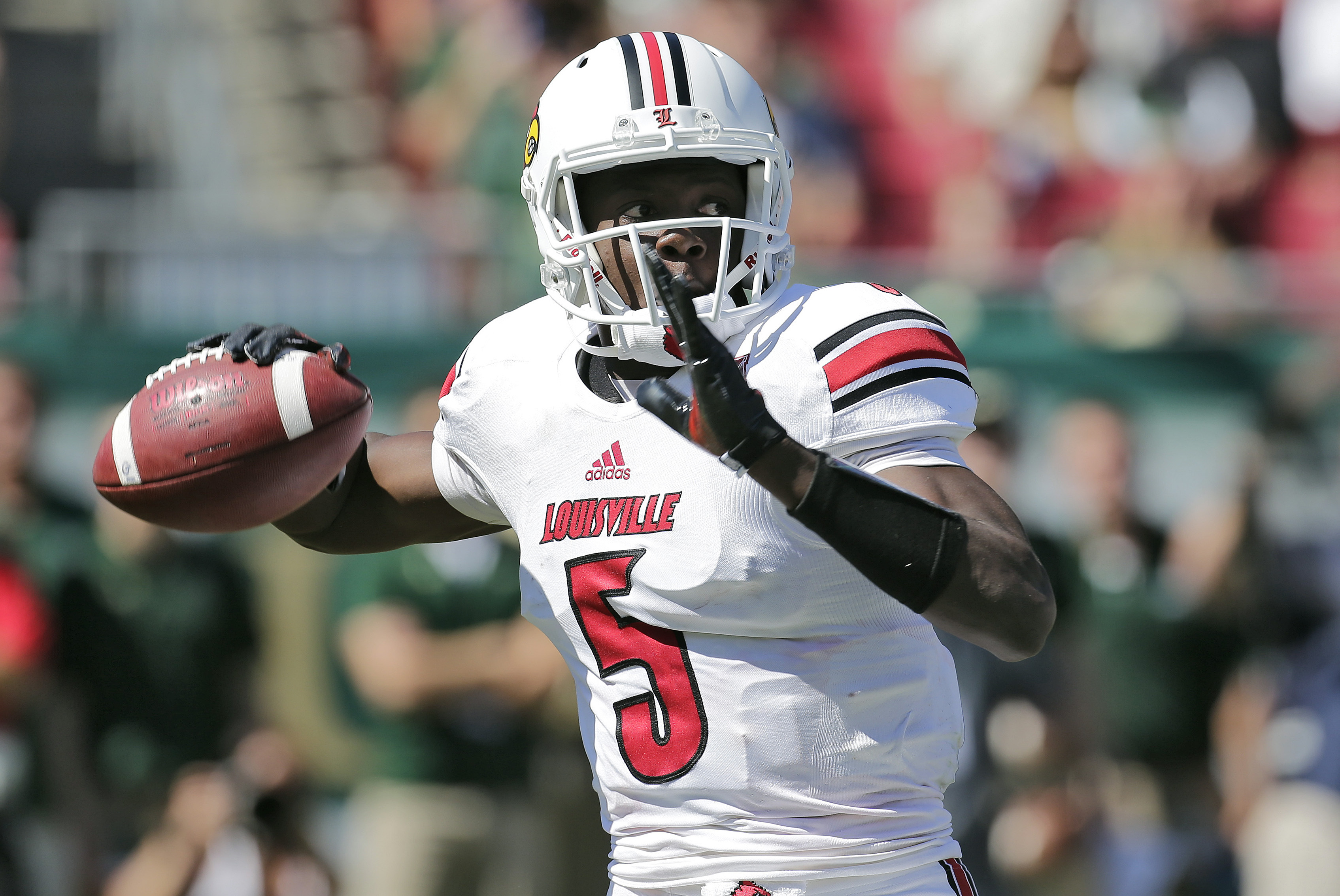 Louisville quarterback Teddy Bridgewater (5) looks for a receiver against South Florida during the first quarter of an NCAA college football game Saturday, Oct. 26, 2013, in Tampa, Fla. (AP Photo/Chris O'Meara)