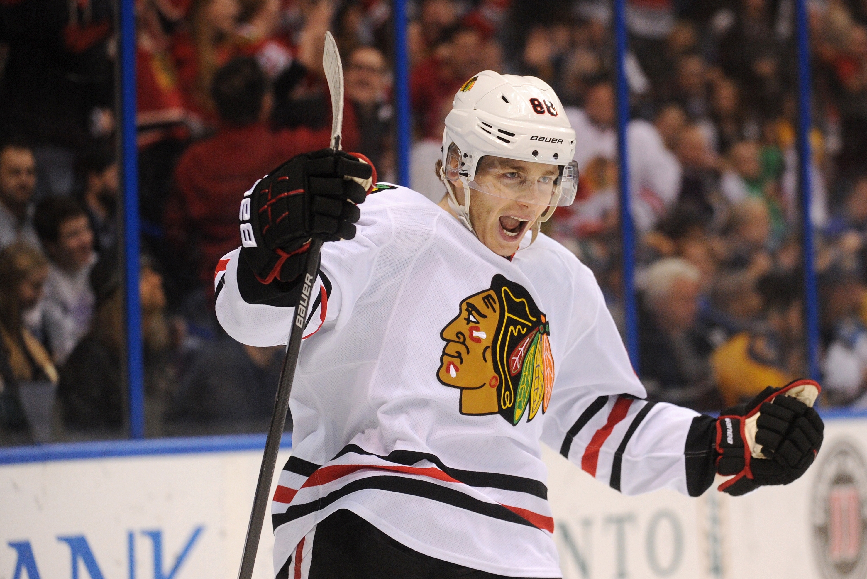 Chicago Blackhawks' Patirck Kane (88) celebrates his goal against the St. Louis Blues in an NHL hockey game Saturday, Dec. 28, 2013, in St. Louis. (AP Photo/Bill Boyce)