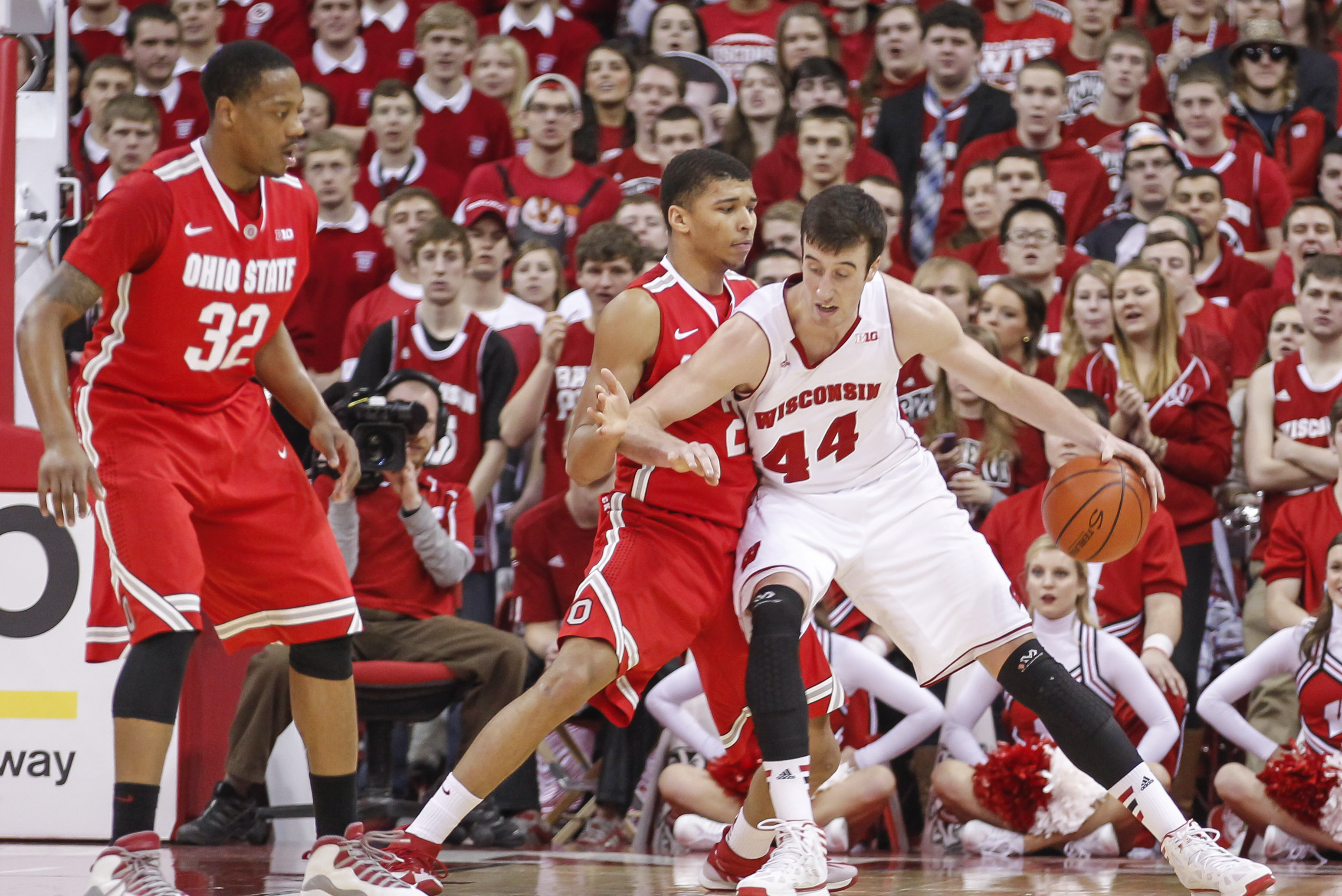 Wisconsin's Frank Kaminsky (2) drives on Ohio State's Marc Loving during the first half of an NCAA college basketball game Saturday, Feb. 1, 2014, in Madison, Wis. (AP Photo/Andy Manis)