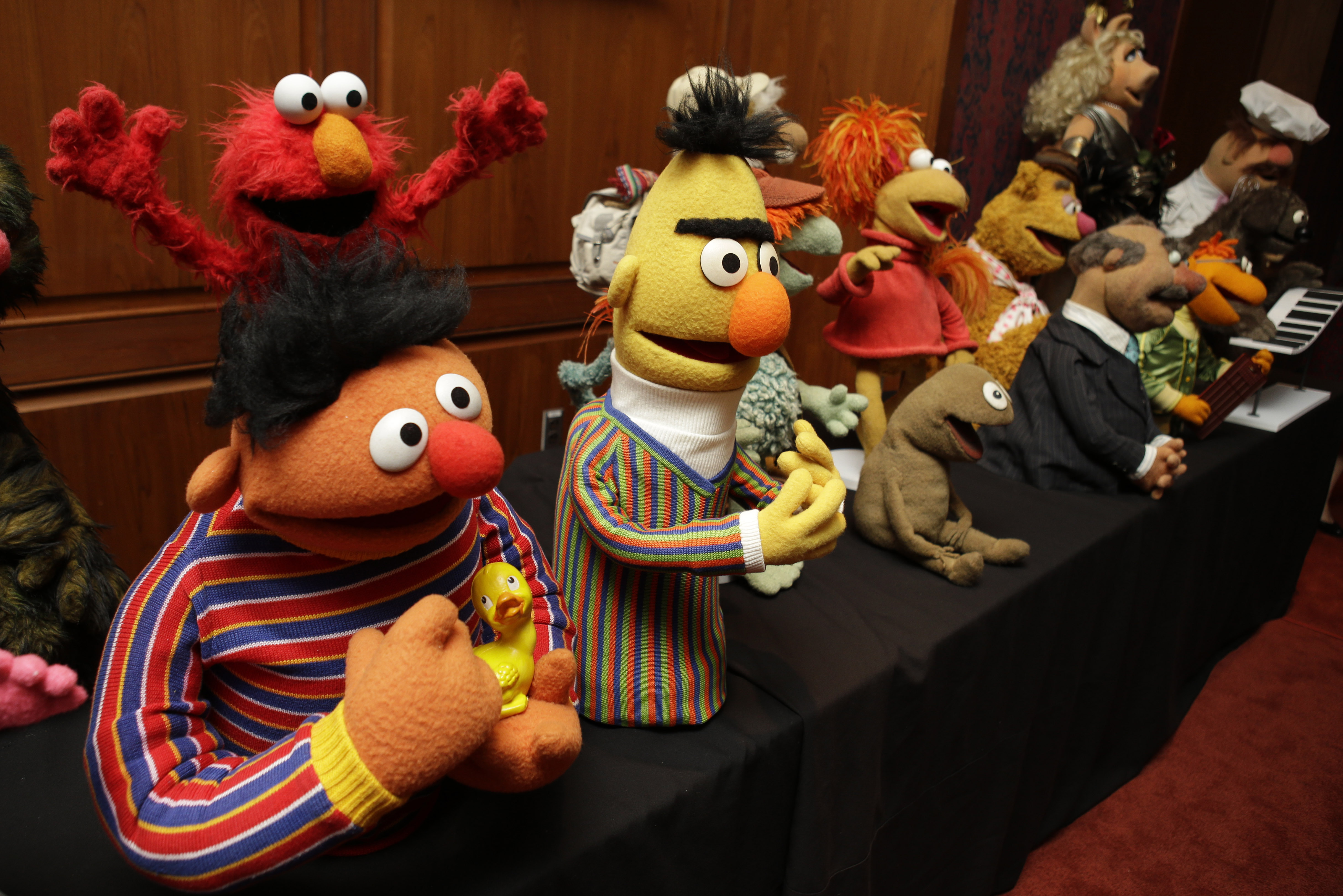 Ernie and Bert, as well as Elmo, top left, are among a donation of additional Jim Henson objects to the Smithsonian's National Museum of American History in Washington, Tuesday, Sept. 24, 2013. Miss Piggy joined Kermit the Frog in the Smithsonian Institution’s collection of Jim Henson’s Muppets, and Bert and Ernie will have a place in history, too. (AP Photo/Jacquelyn Martin)