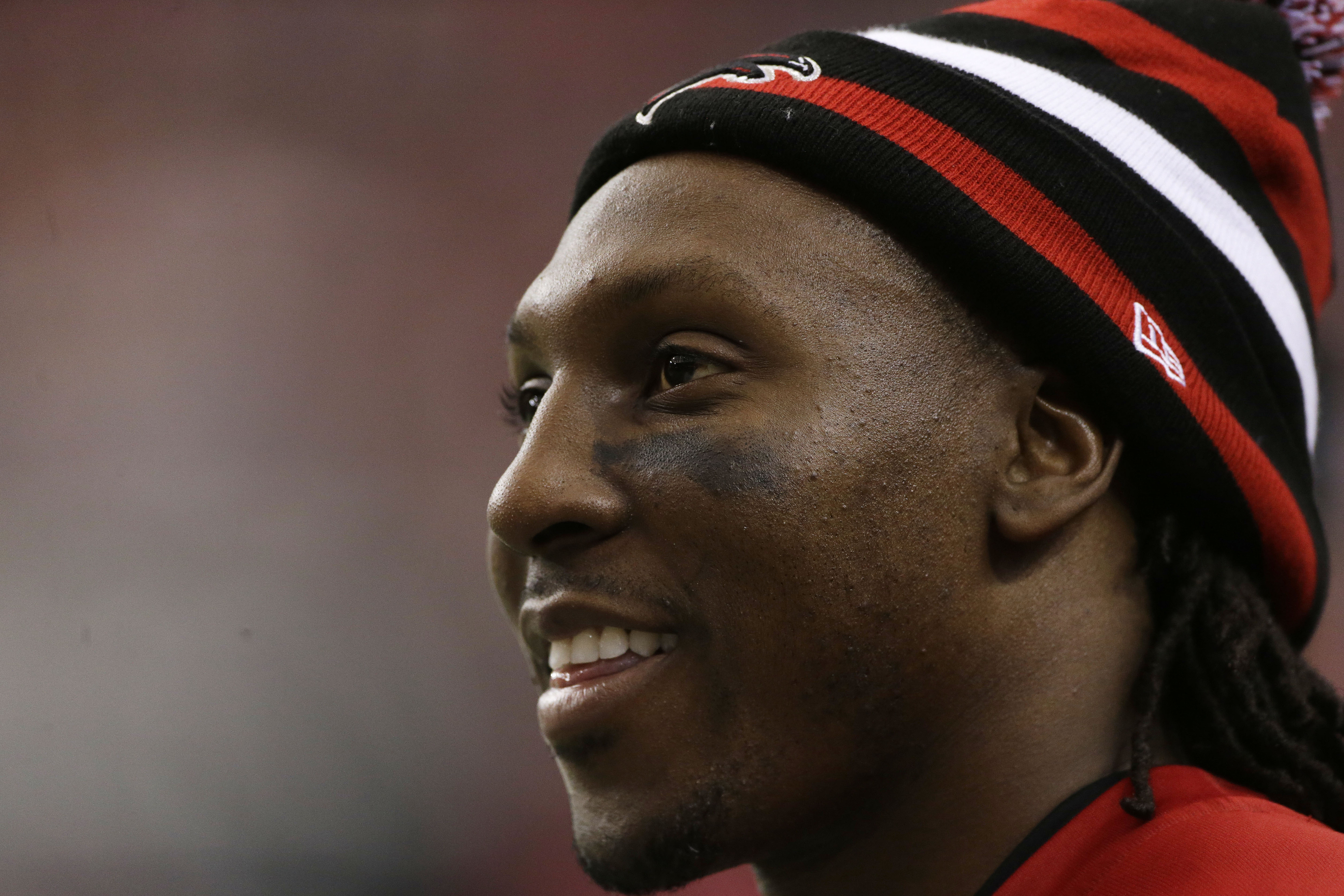 Injured Atlanta Falcons wide receiver Roddy White watches play against the Tampa Bay Buccaneers during the second half of an NFL football game, Sunday, Oct. 20, 2013, in Atlanta. (AP Photo/John Bazemore)