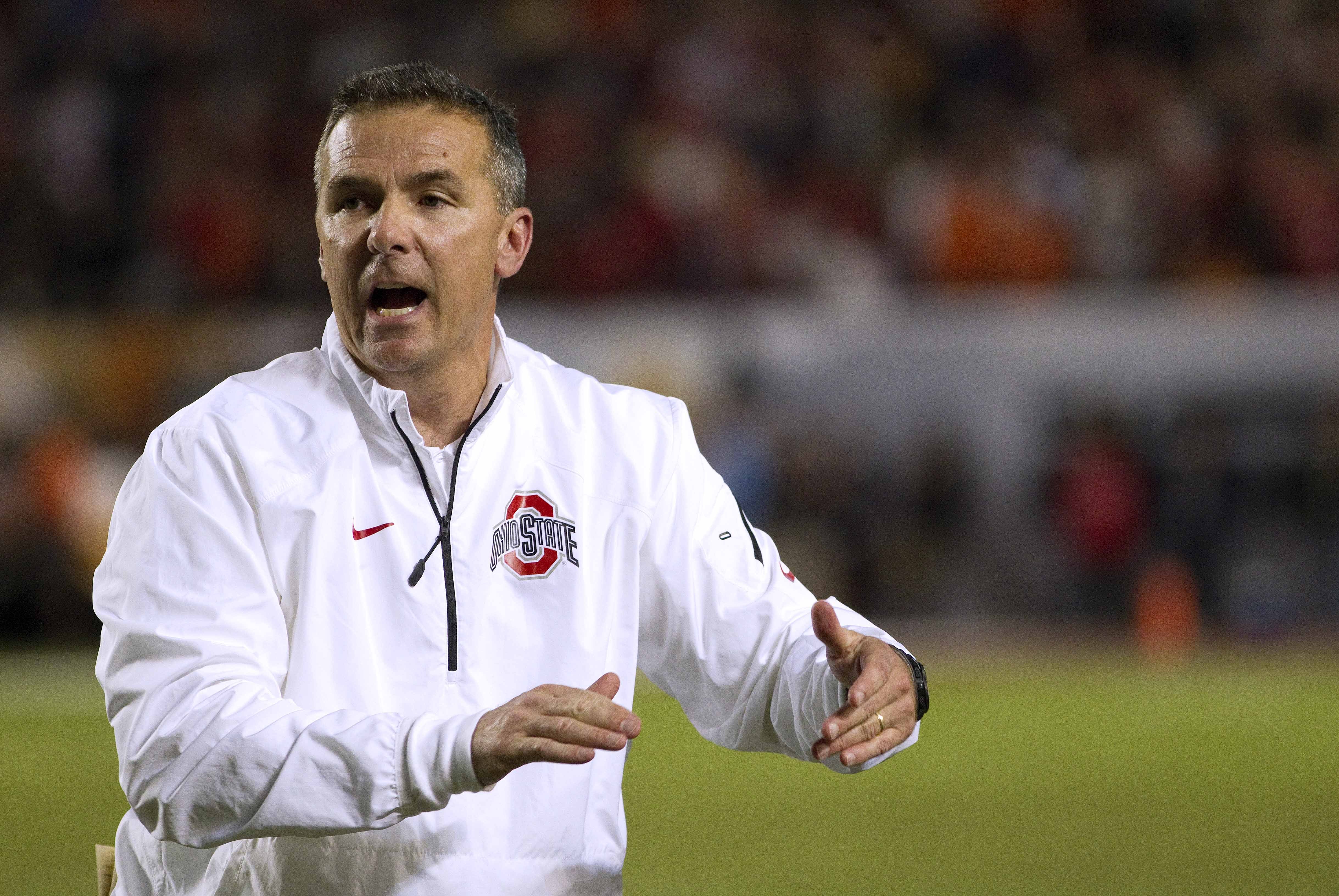 Jan 3, 2014; Miami Gardens, FL, USA; Ohio State Buckeyes head coach Urban Meyer reacts during the first half in the 2014 Orange Bowl college football game against the Clemson Tigers at Sun Life Stadium. Mandatory Credit: Joshua S. Kelly-USA TODAY Sports