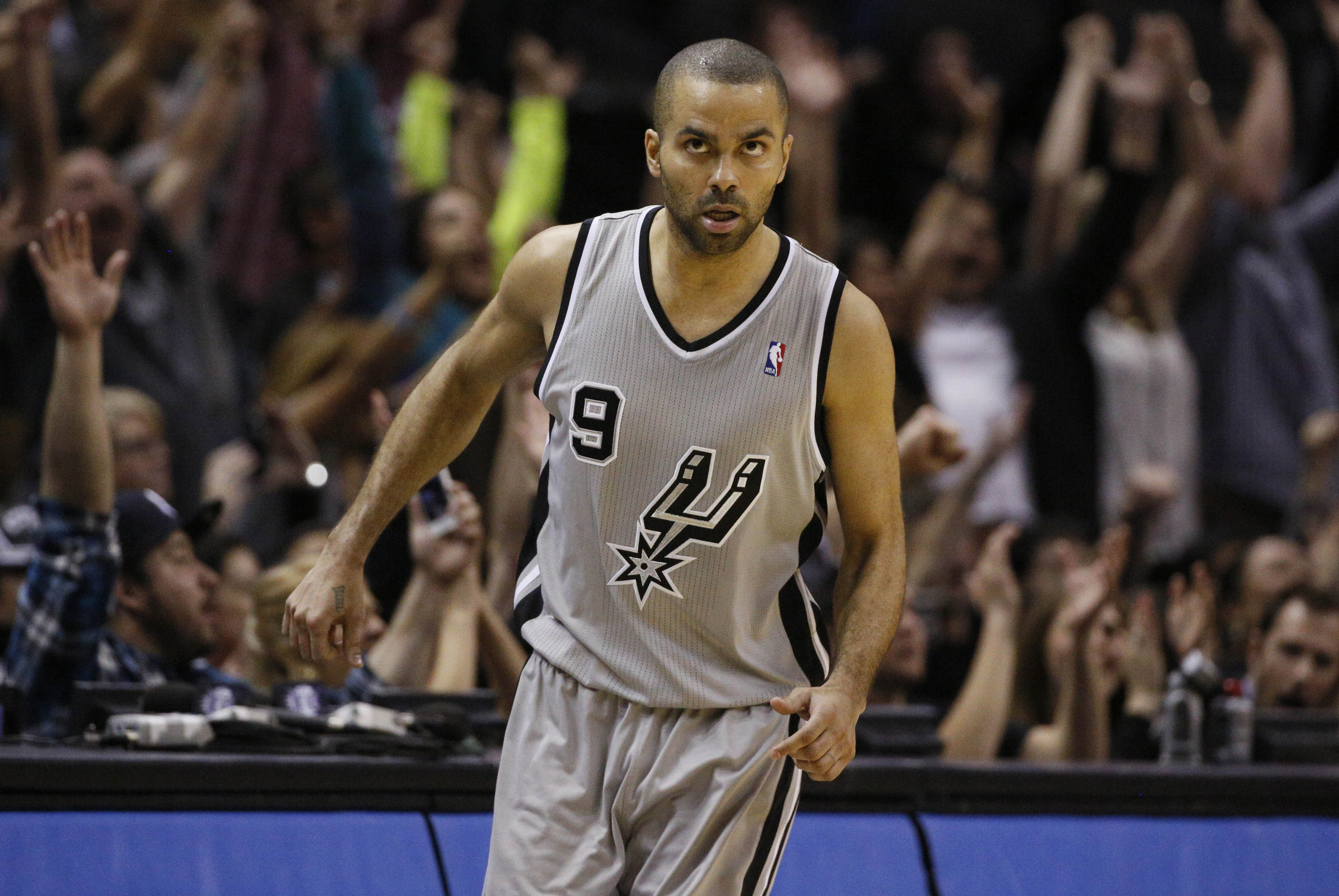 Feb 1, 2014; San Antonio, TX, USA; San Antonio Spurs guard Tony Parker (9) reacts after a shot  during the second half against the Sacramento Kings at AT&T Center. The Spurs won 95-93. Mandatory Credit: Soobum Im-USA TODAY Sports