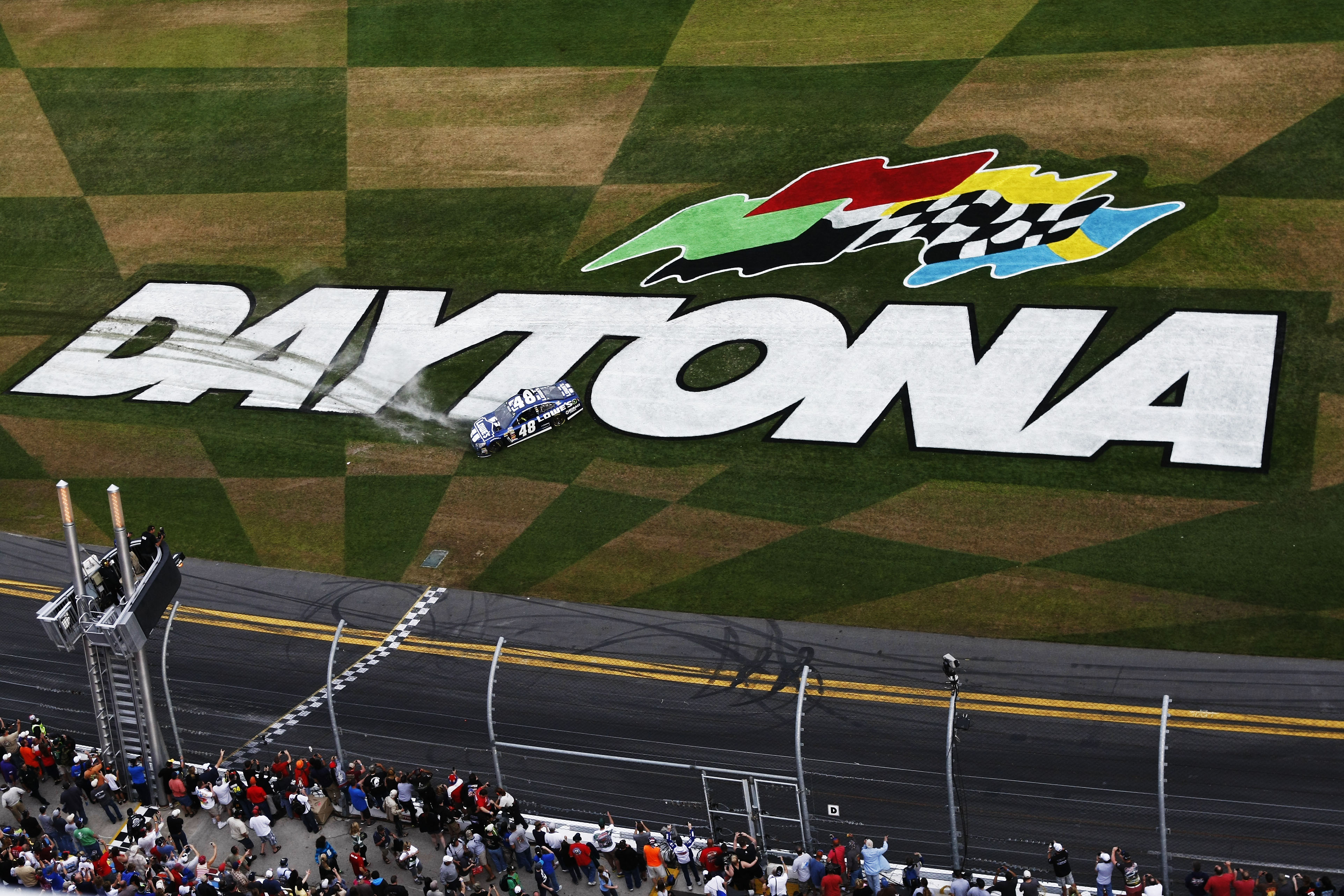 DAYTONA BEACH, FL - FEBRUARY 24:  Jimmie Johnson, driver of the #48 Lowe's Chevrolet, celebrates winning the NASCAR Sprint Cup Series Daytona 500 at Daytona International Speedway on February 24, 2013 in Daytona Beach, Florida.  (Photo by Jonathan Ferrey/Getty Images)