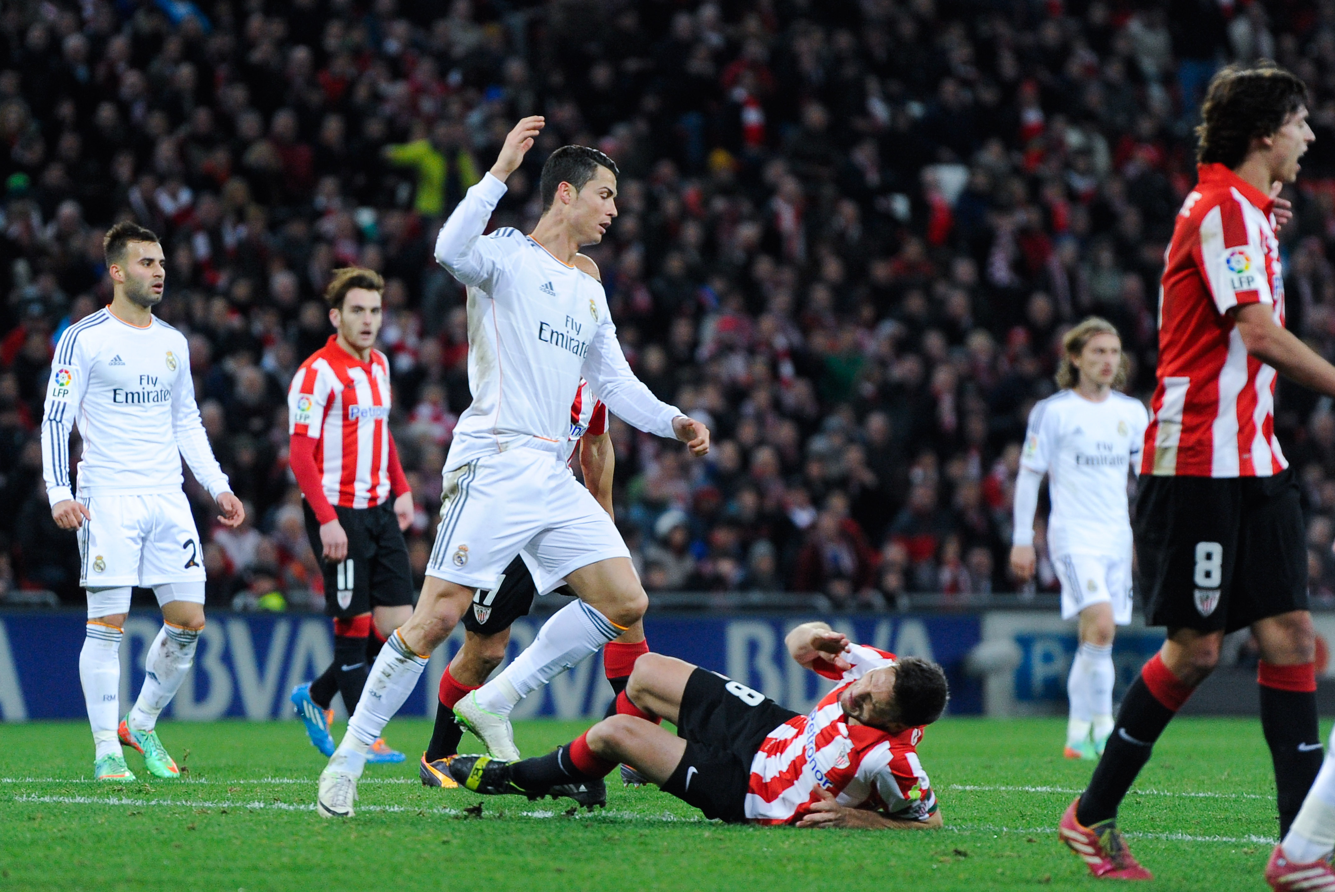 BILBAO, SPAIN - FEBRUARY 02:  Carlos Gurpegi of Athletic Club is is brought down by Cristiano Ronaldo of Real Madrid CF during the La Liga match between Athletic Club and Real Madrid CF at San Mames Stadium on February 2, 2014 in Bilbao, Spain.  (Photo by David Ramos/Getty Images)