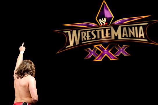Daniel Bryan points to the WWE WrestleMania sign after his win against Randy Orton.