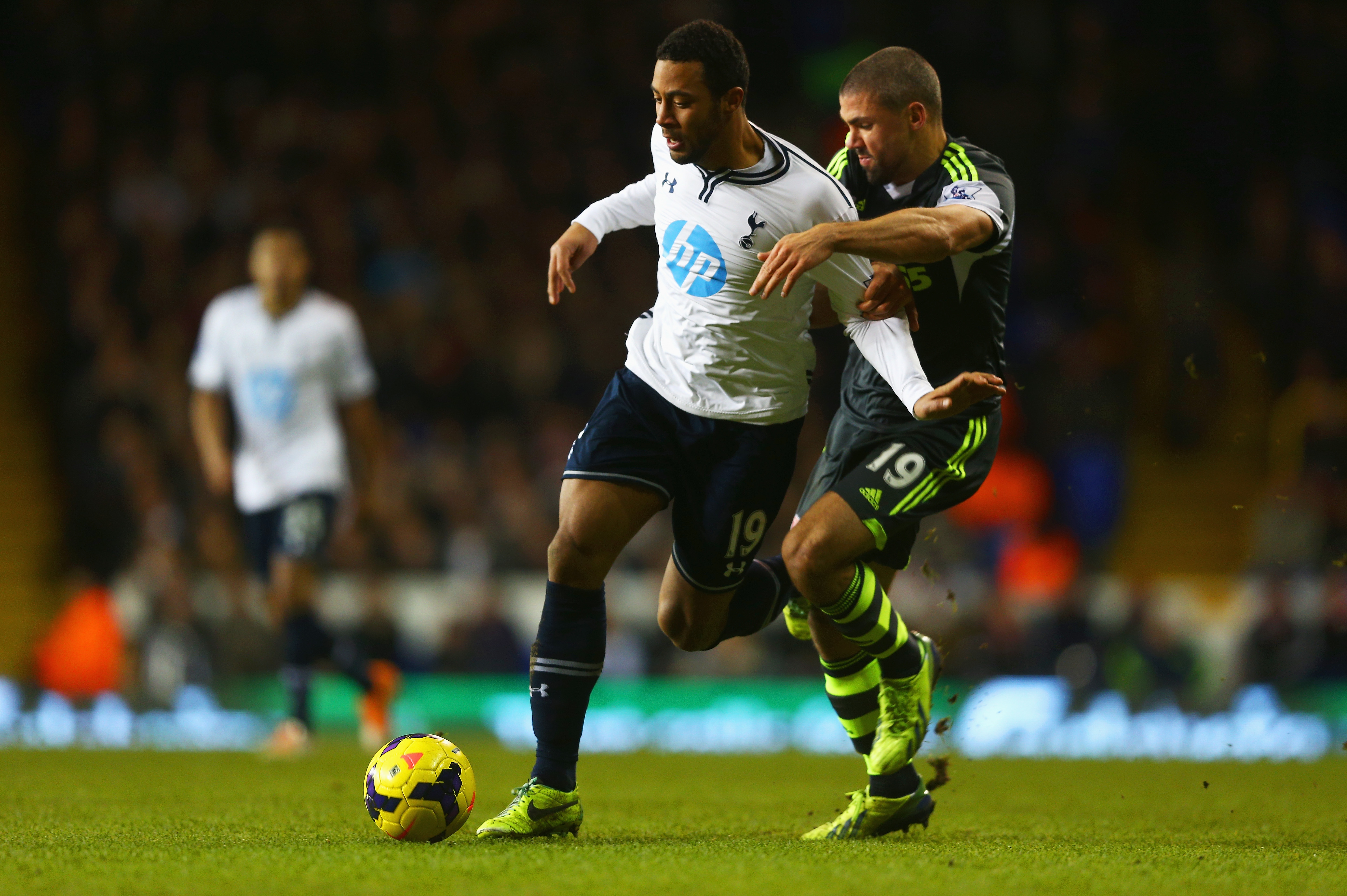LONDON, ENGLAND - DECEMBER 29: Mousa Dembele of Tottenham Hotspur is challenged by Jonathan Walters of Stoke City during the Barclays Premier League match between Tottenham Hotspur and Stoke City at White Hart Lane on December 29, 2013 in London, England.  (Photo by Paul Gilham/Getty Images)