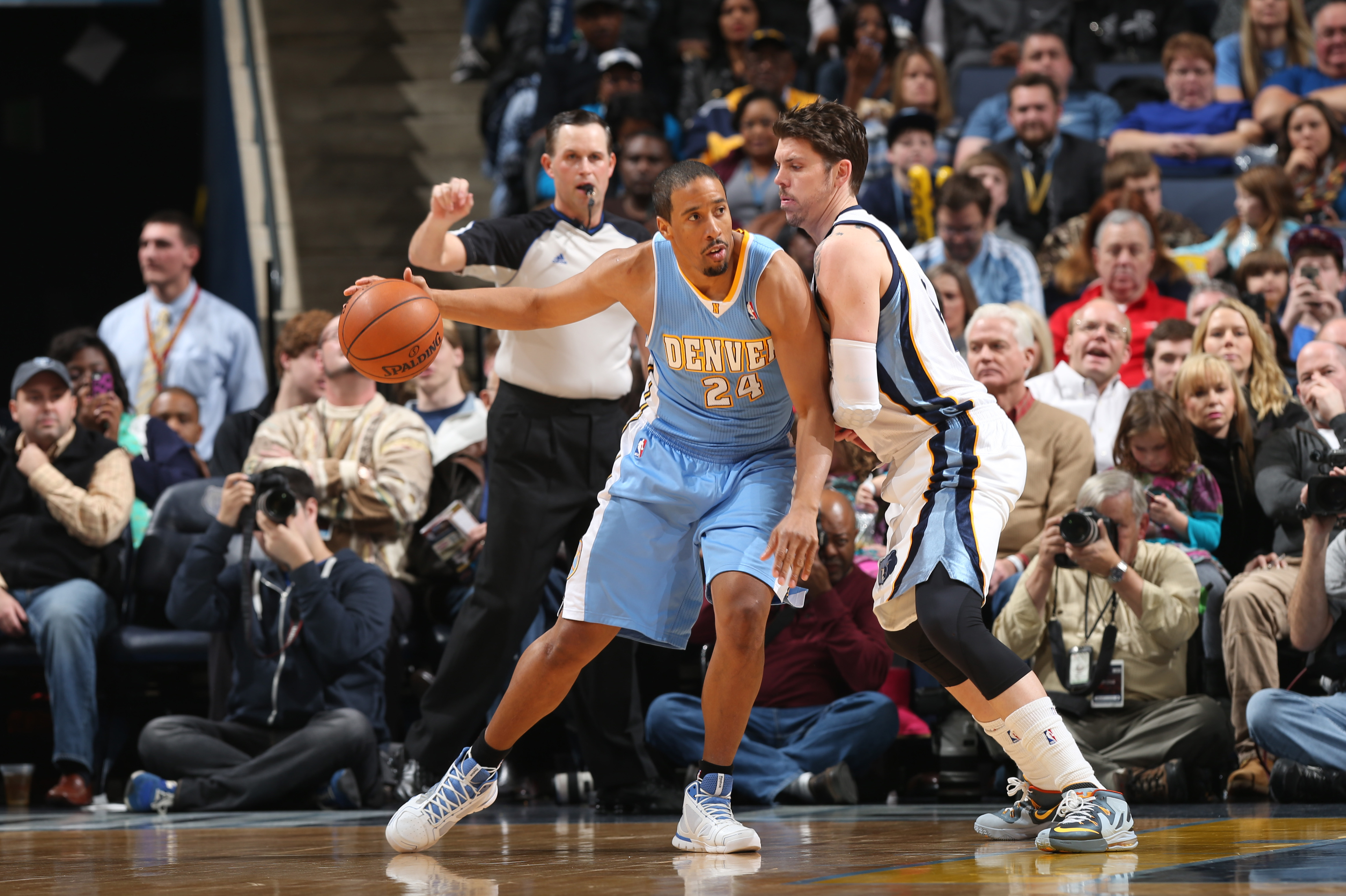 MEMPHIS, TN - DECEMBER 28: Andre Miller #24 of the Denver Nuggets controls the ball against Mike Miller #13 of the Memphis Grizzlies on December 28, 2013 at FedExForum in Memphis, Tennessee. NOTE TO USER: User expressly acknowledges and agrees that, by downloading and or using this photograph, User is consenting to the terms and conditions of the Getty Images License Agreement. Mandatory Copyright Notice: Copyright 2013 NBAE (Photo by Joe Murphy/NBAE via Getty Images)