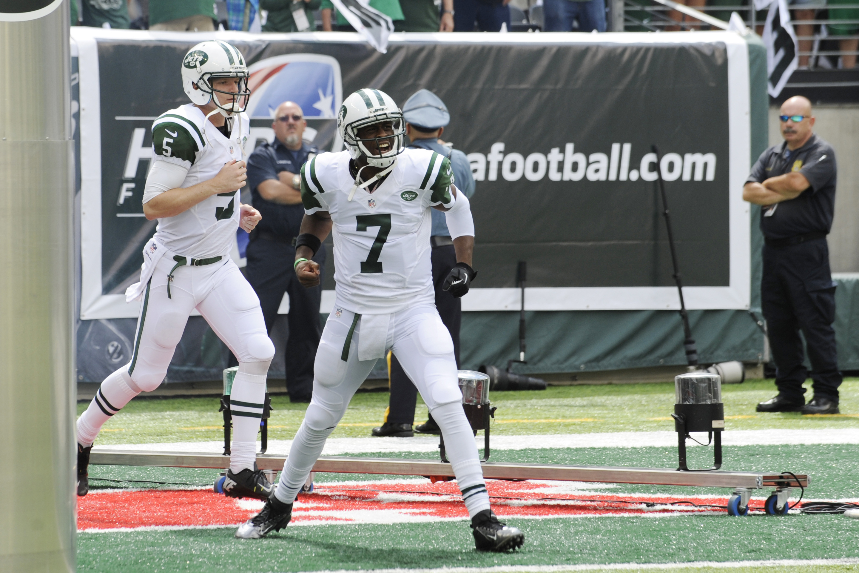 New York Jets quarterback Geno Smith (7) and quarterback Matt Simms (5) take the field before an NFL football game against the Tampa Bay Buccaneers, Sunday, Sept. 8, 2013, in East Rutherford, N.J. (AP Photo/Bill Kostroun)