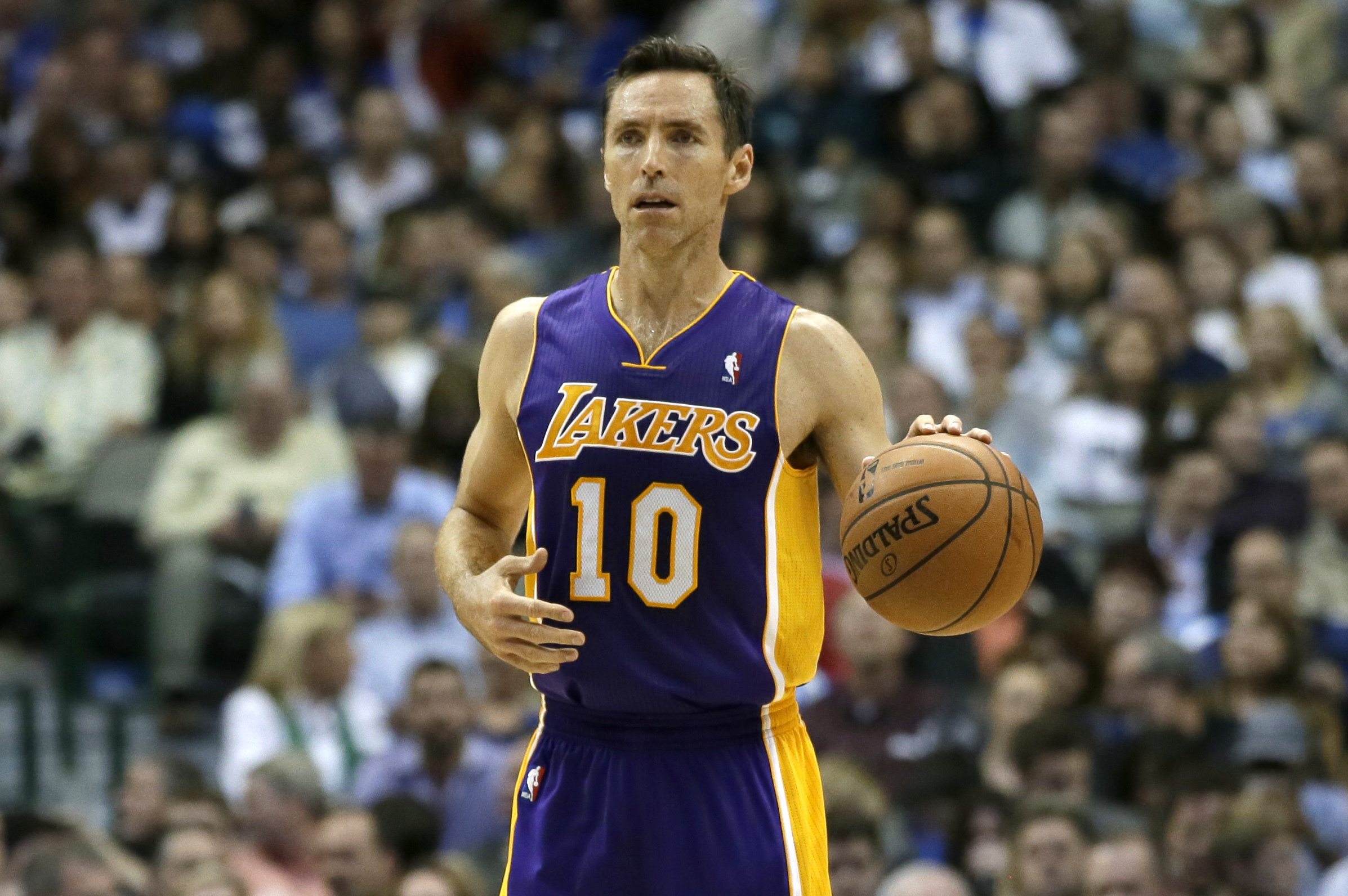 Los Angeles Lakers' Steve Nash (10) moves the ball up court against the Dallas Mavericks during an NBA basketball game, Tuesday, Nov. 5, 2013, in Dallas. The Mavericks won 123-104. (AP Photo/Tony Gutierrez)