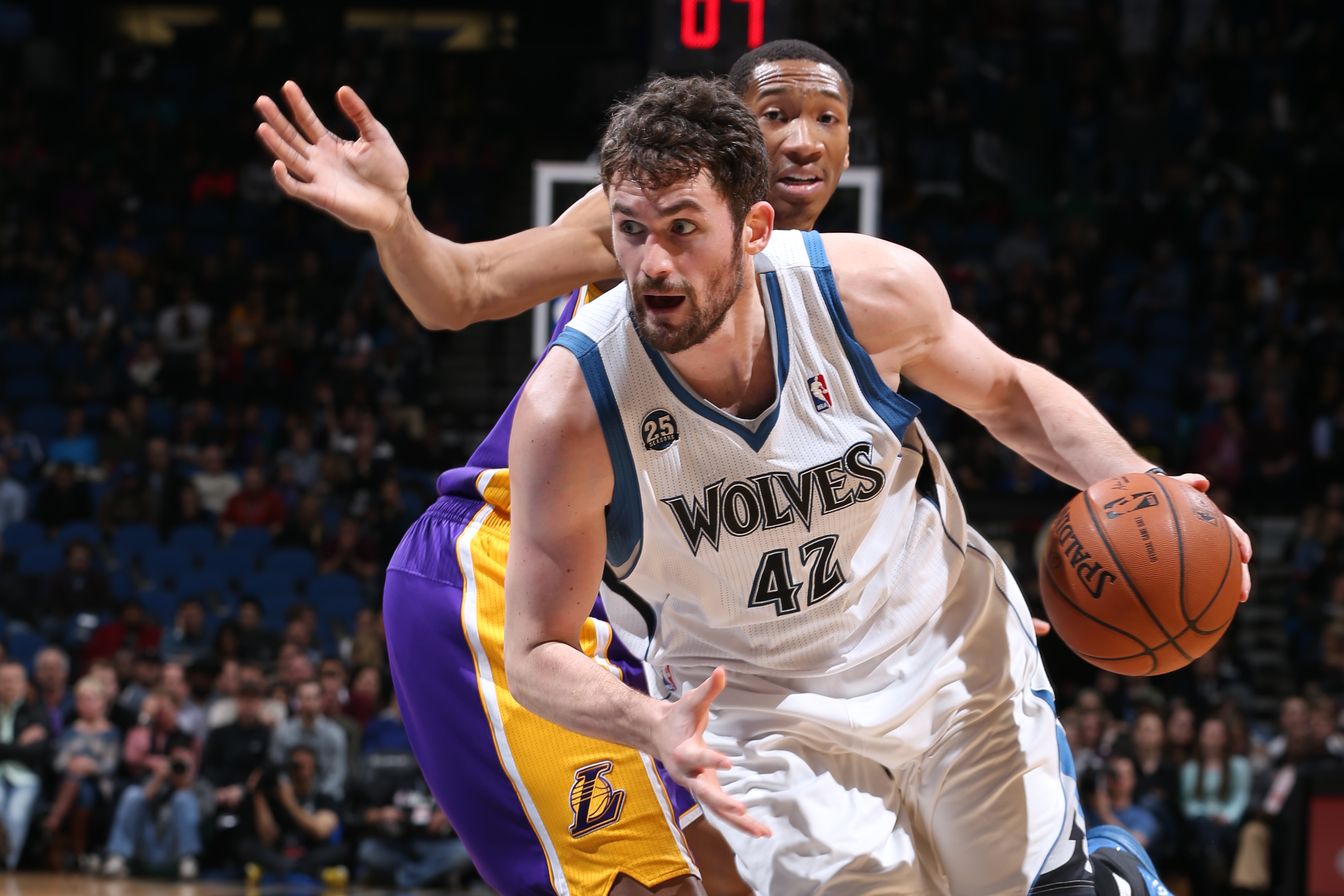 MINNEAPOLIS, MN - FEBRUARY 4:  Kevin Love #42 of the Minnesota Timberwolves handling the ball during a game against the Los Angeles Lakers on February 4, 2014 at Target Center in Minneapolis, Minnesota. NOTE TO USER: User expressly acknowledges and agrees that, by downloading and or using this Photograph, user is consenting to the terms and conditions of the Getty Images License Agreement. Mandatory Copyright Notice: Copyright 2014 NBAE (Photo by David Sherman/NBAE via Getty Images)