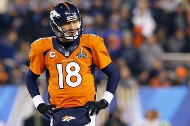 Denver Broncos' Peyton Manning pauses during the second half of the NFL Super Bowl XLVIII football game against the Denver Broncos Sunday, Feb. 2, 2014, in East Rutherford, N.J. (AP Photo/Paul Sancya)