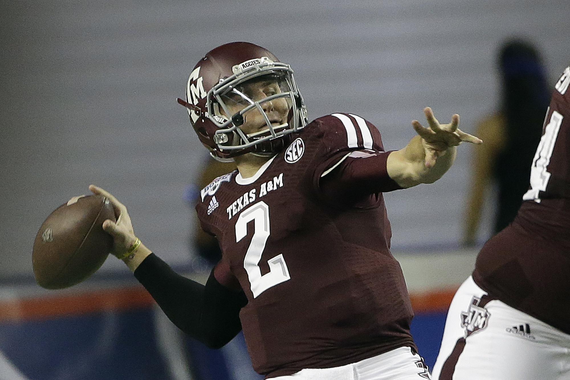 Texas A&M quarterback Johnny Manziel (2) looks for a receiver in the first half of the Chick-fil-A Bowl NCAA college football game against Duke Tuesday, Dec. 31, 2013, in Atlanta. (AP Photo/John Bazemore)