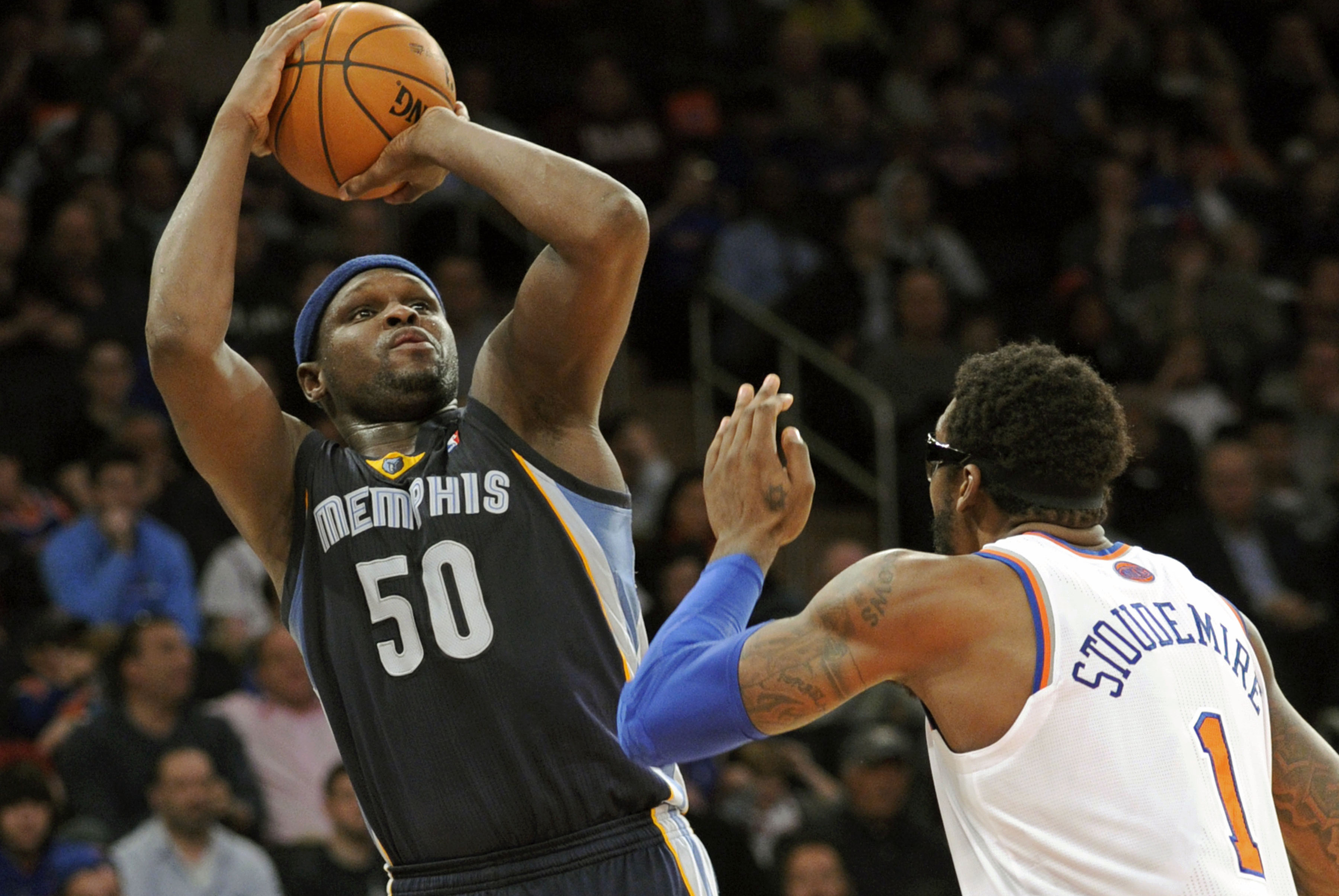Memphis Grizzlies' Zach Randolph (50) goes up for a shot over New York Knicks' Amar'e Stoudemire during the third quarter of an NBA basketball game Saturday, Dec. 21, 2013, at Madison Square Garden in New York. The Grizzlies defeated the Knicks 95-87. (AP Photo/Bill Kostroun)