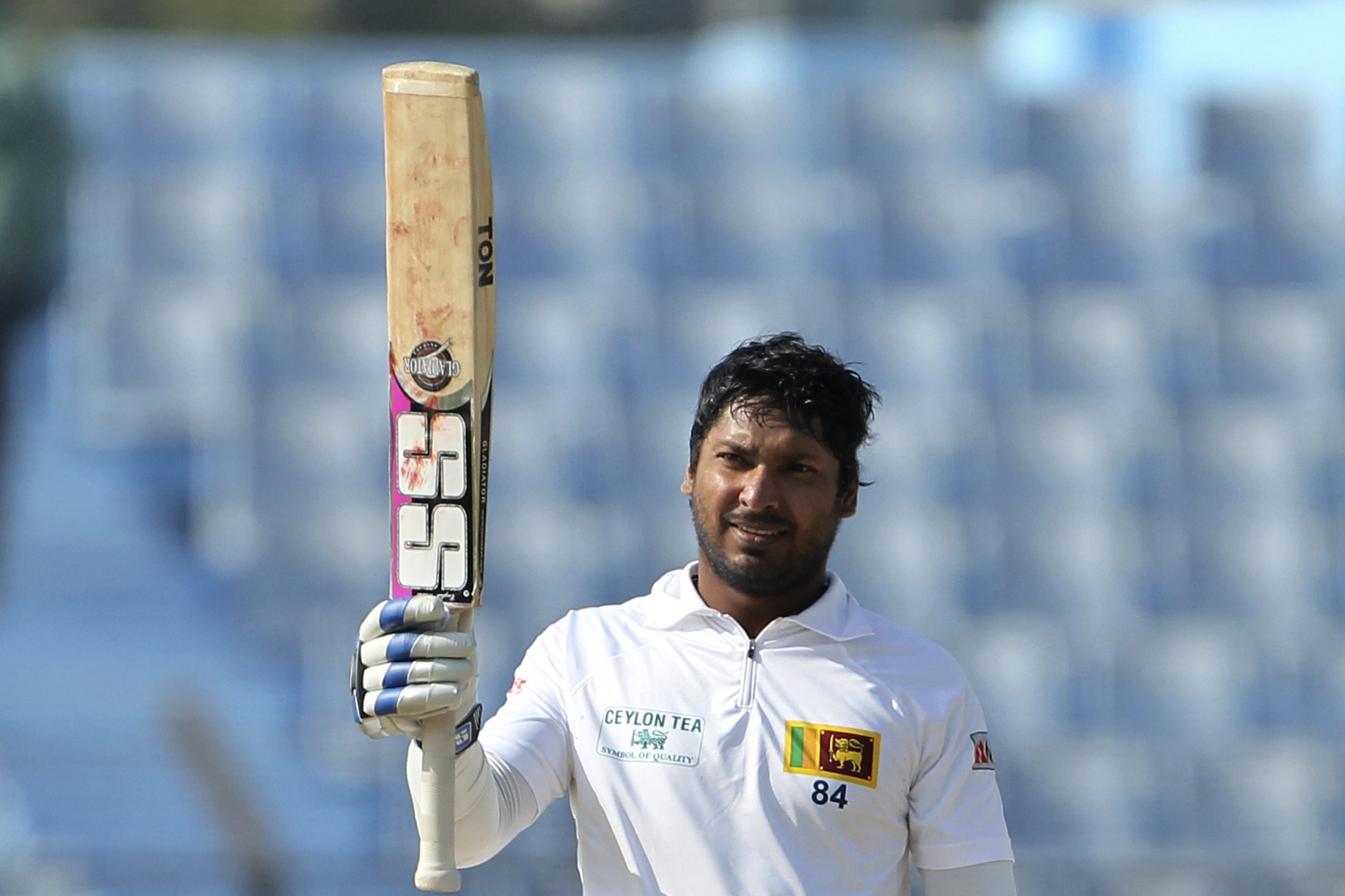 Sri Lanka’s Kumar Sangakkara acknowledges the crowd after scoring a century on the first day of the second test cricket match against Bangladesh in Chittagong, Bangladesh, Tuesday, Feb. 4, 2014. Sangakkara's 34th century steered Sri Lanka to a commanding 314-5 against Bangladesh at stumps Tuesday.(AP Photo)