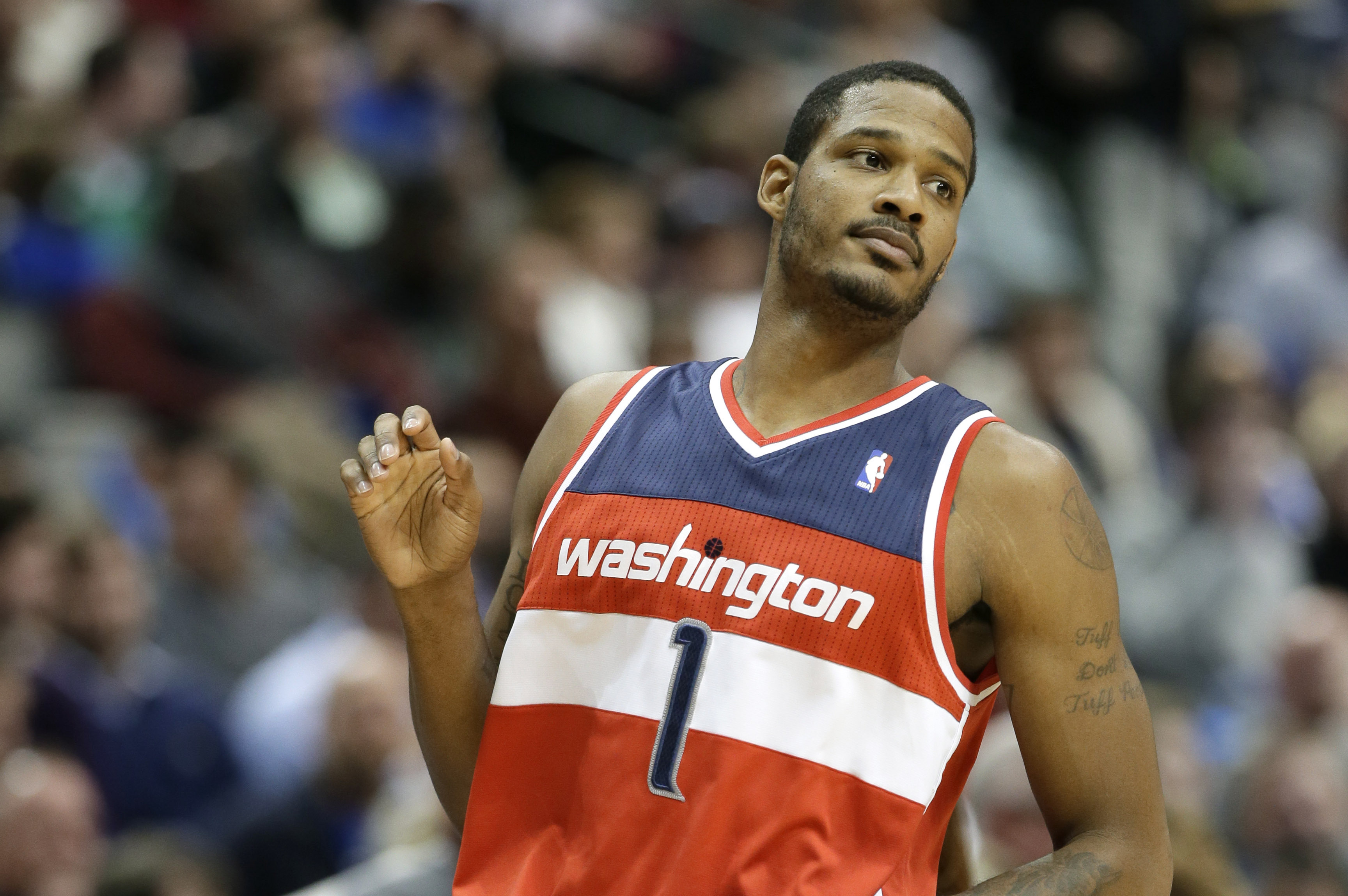 Washington Wizards forward Trevor Ariza (1) runs up court during an NBA basketball game against the Dallas Mavericks, Tuesday, Nov. 12, 2013, in Dallas. The Mavericks won 105-95. (AP Photo/Tony Gutierrez)