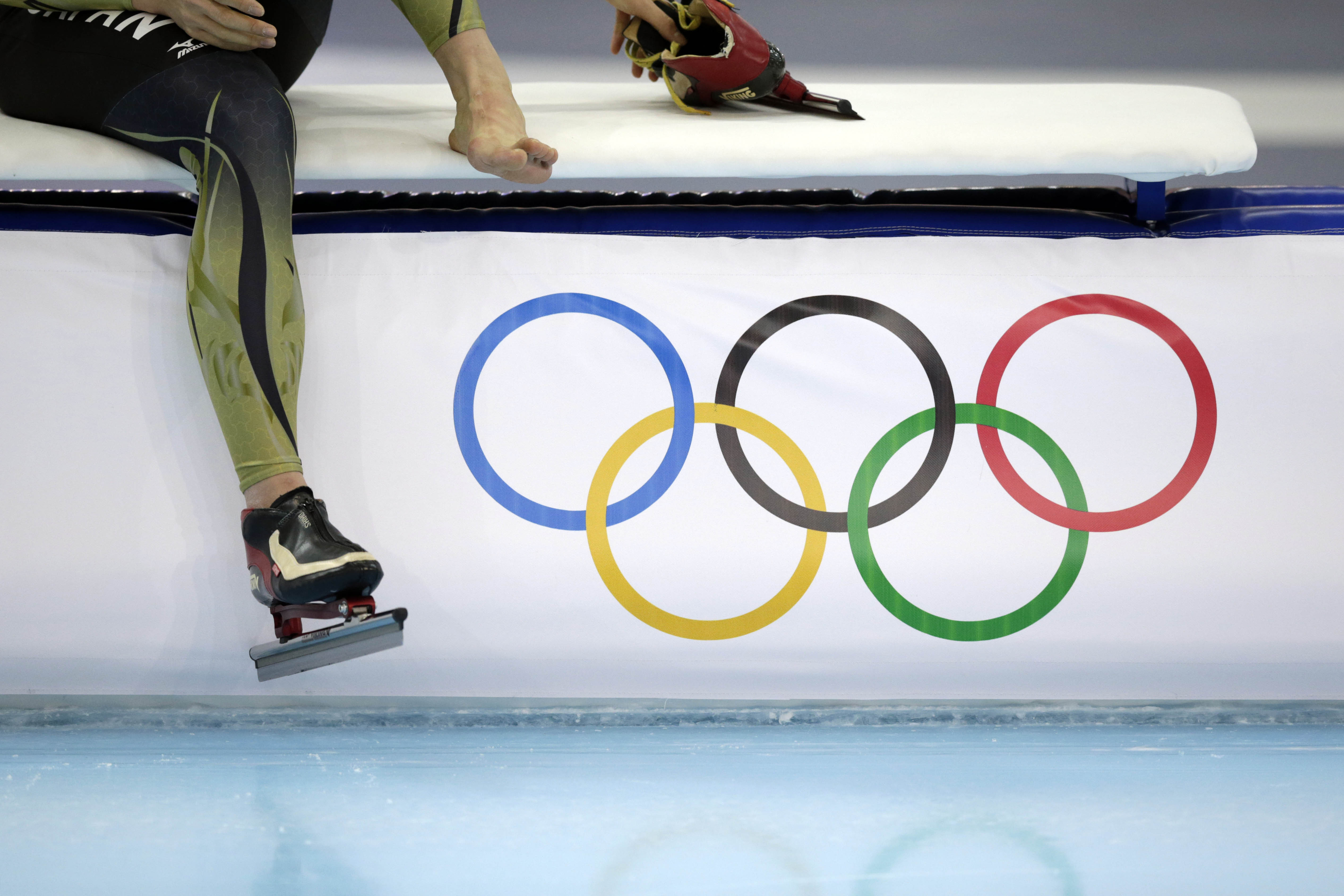 Japanese speedskater Shiho Ishizawa adjusts her skates as she trains at the Adler Arena Skating Center during the 2014 Winter Olympics in Sochi, Russia, Wednesday, Feb. 5, 2014. (AP Photo/Matt Dunham)