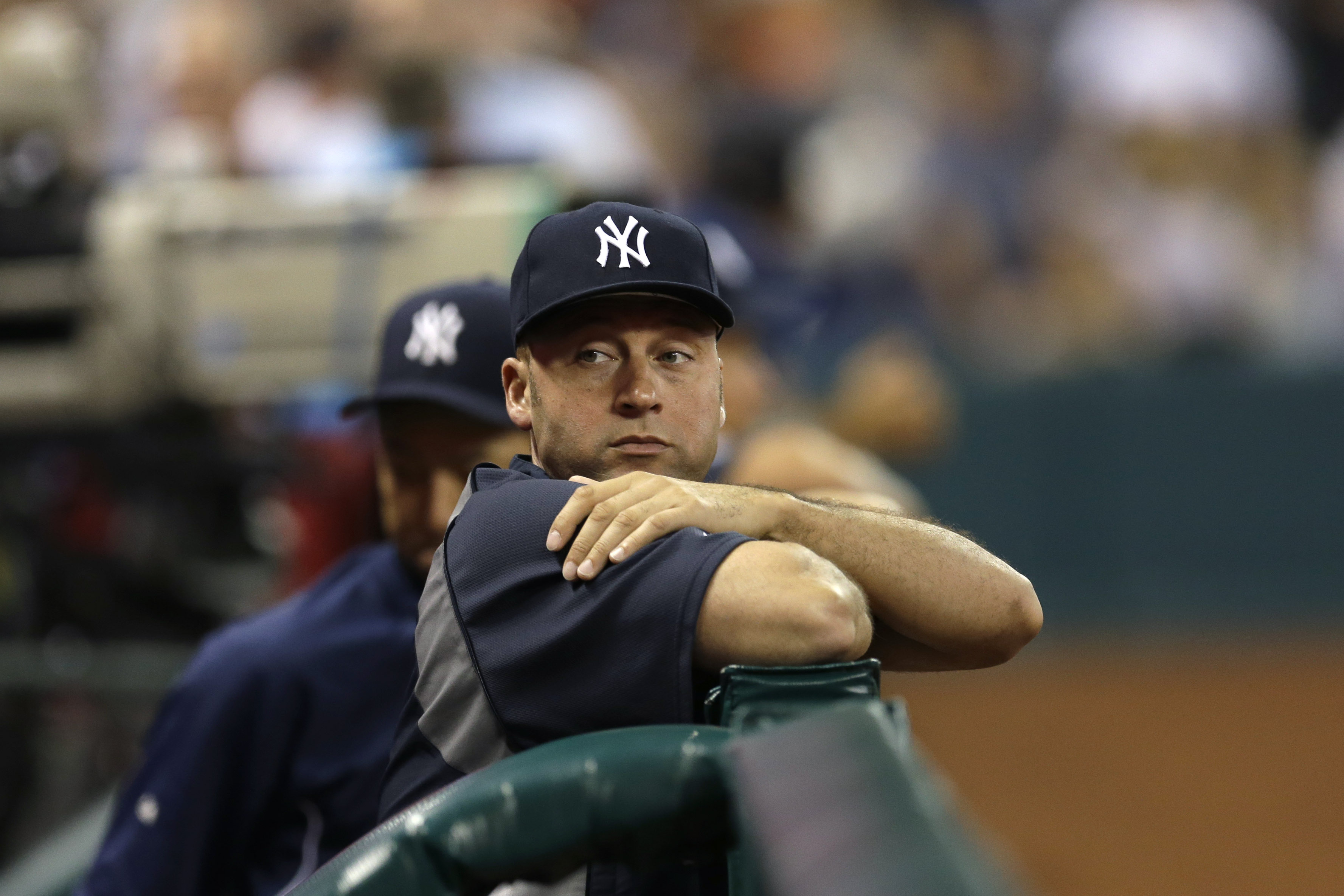 New York Yankees shortstop Derek Jeter watches from the dugout during the seventh inning of a baseball game against the Houston Astros Saturday, Sept. 28, 2013, in Houston. (AP Photo/David J. Phillip)