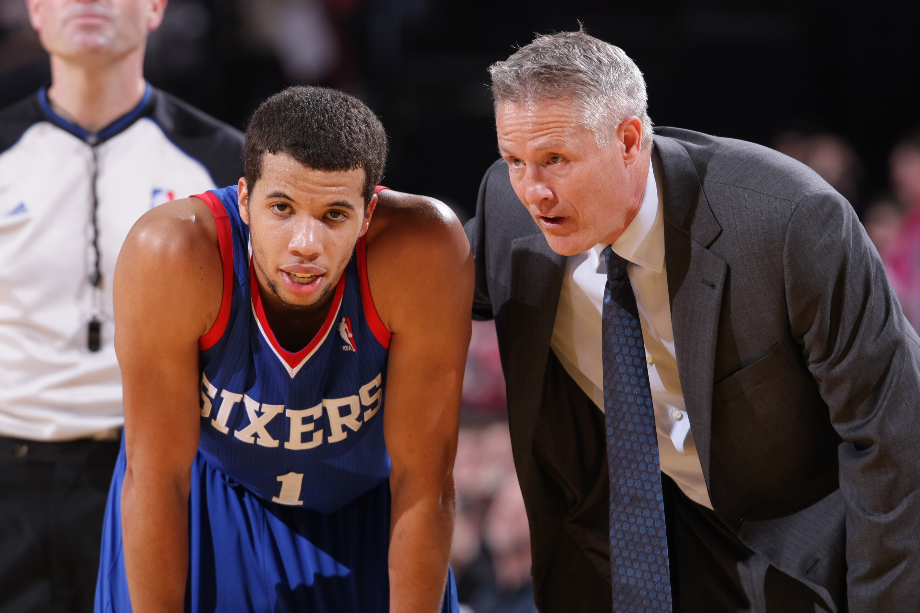 PORTLAND, OR - JANUARY 4:  Michael Carter-Williams #1 and Brett Brown of the Philadelphia 76ers talk during the game against the Portland Trail Blazers on January 4, 2014 at the Moda Center Arena in Portland, Oregon. NOTE TO USER: User expressly acknowledges and agrees that, by downloading and or using this photograph, user is consenting to the terms and conditions of the Getty Images License Agreement. Mandatory Copyright Notice: Copyright 2014 NBAE (Photo by Sam Forencich/NBAE via Getty Images)
