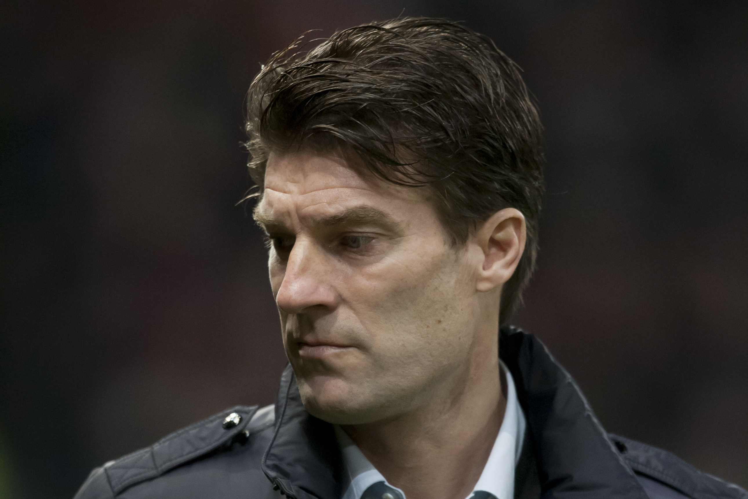 Swansea City's manager Michael Laudrup takes to the touchline before his team's English Premier League soccer match against Manchester United at Old Trafford Stadium, Manchester, England, Saturday Jan. 11, 2014. (AP Photo/Jon Super)