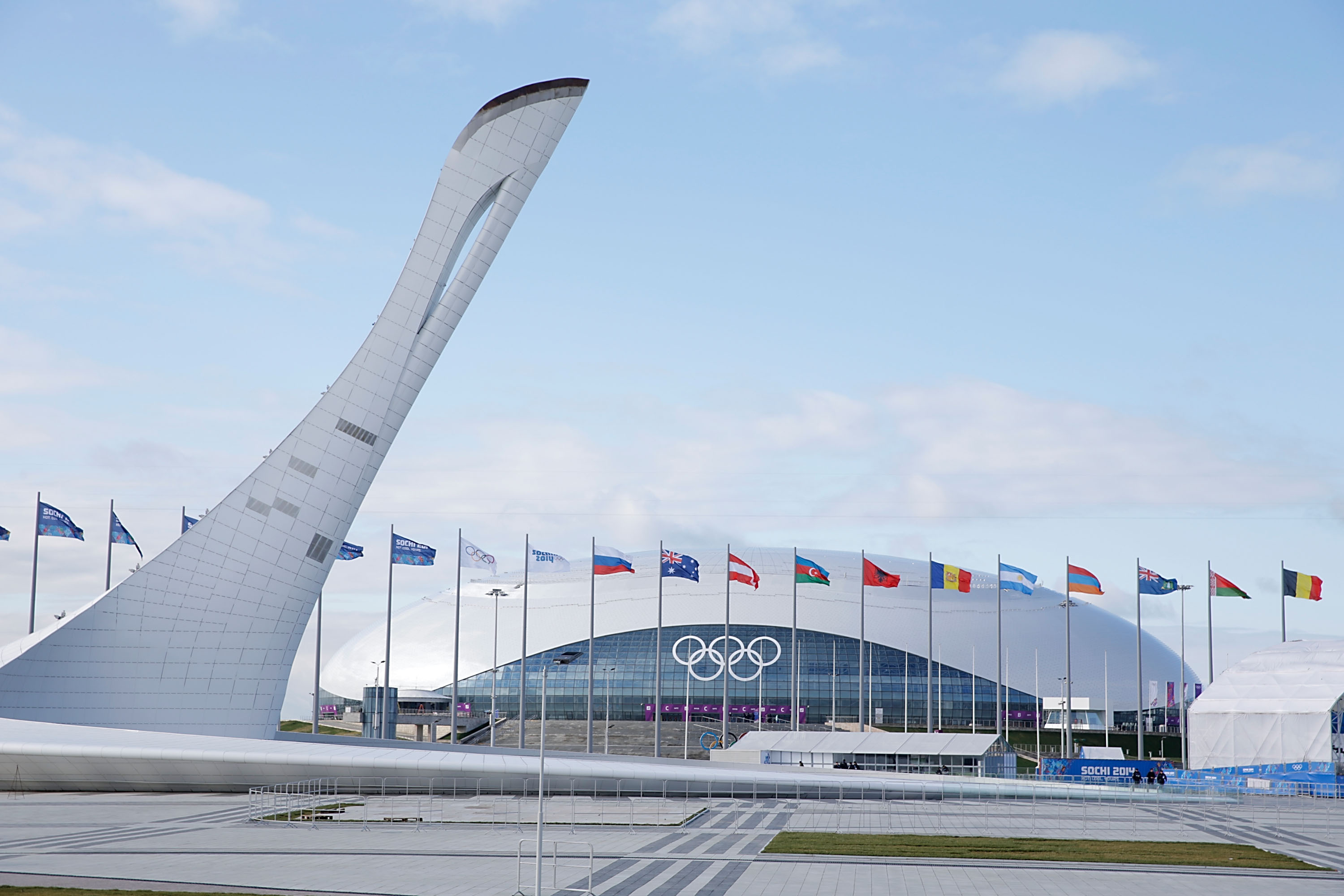 SOCHI, RUSSIA - FEBRUARY 01:  The unlit Olympic torch stands infront of the Bolshoy Ice Dome prior to the Sochi 2014 Winter Olympics in the Olympic Park Coastal Cluster on February 1, 2014 in Sochi, Russia.  (Photo by Joe Scarnici/Getty Images)