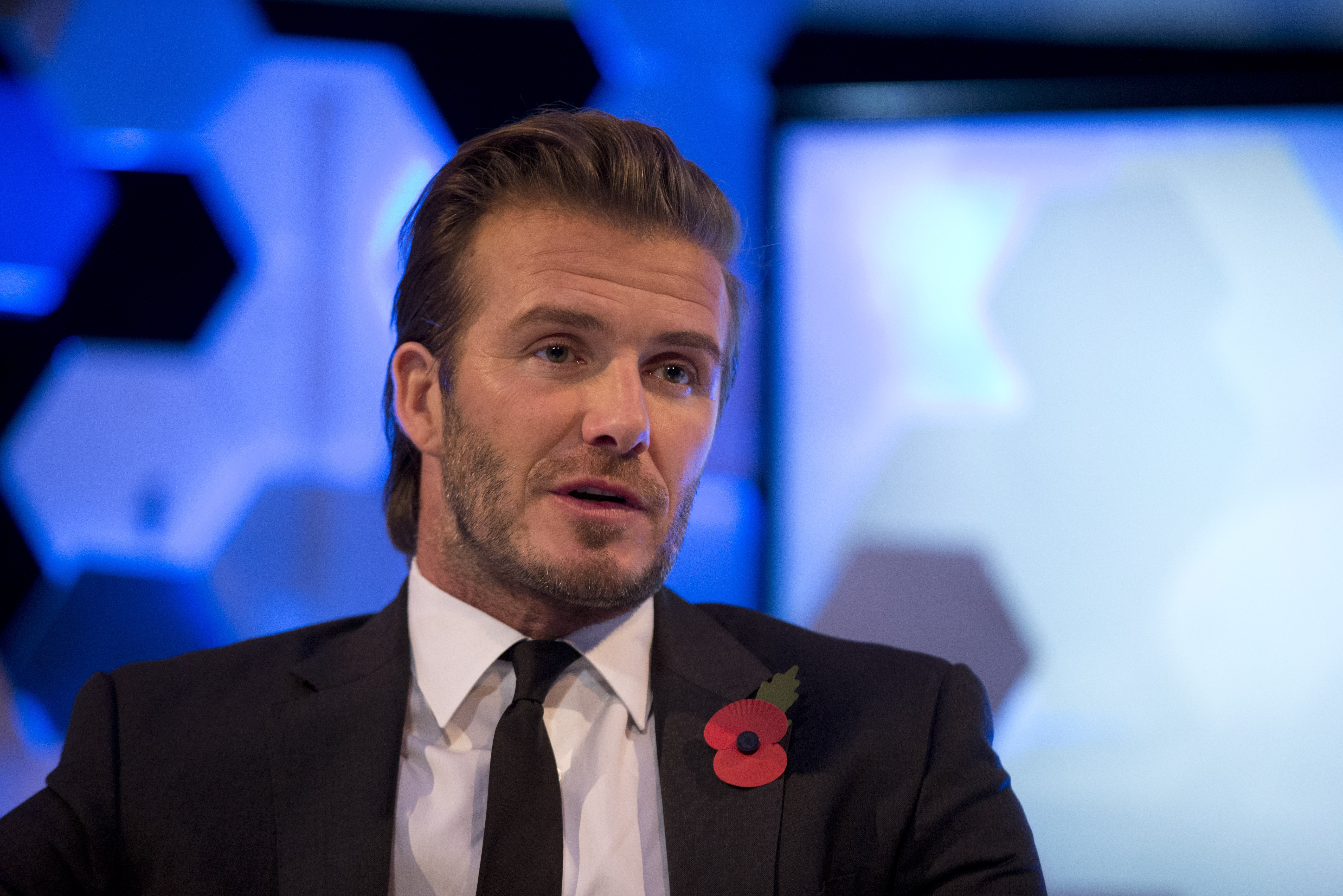 Former England national soccer team captain David Beckham speaks as he is interviewed by The Associated Press at a studio in Hampstead, north London, Wednesday, Oct. 30, 2013.  Beckham was promoting his new photography book entitled
