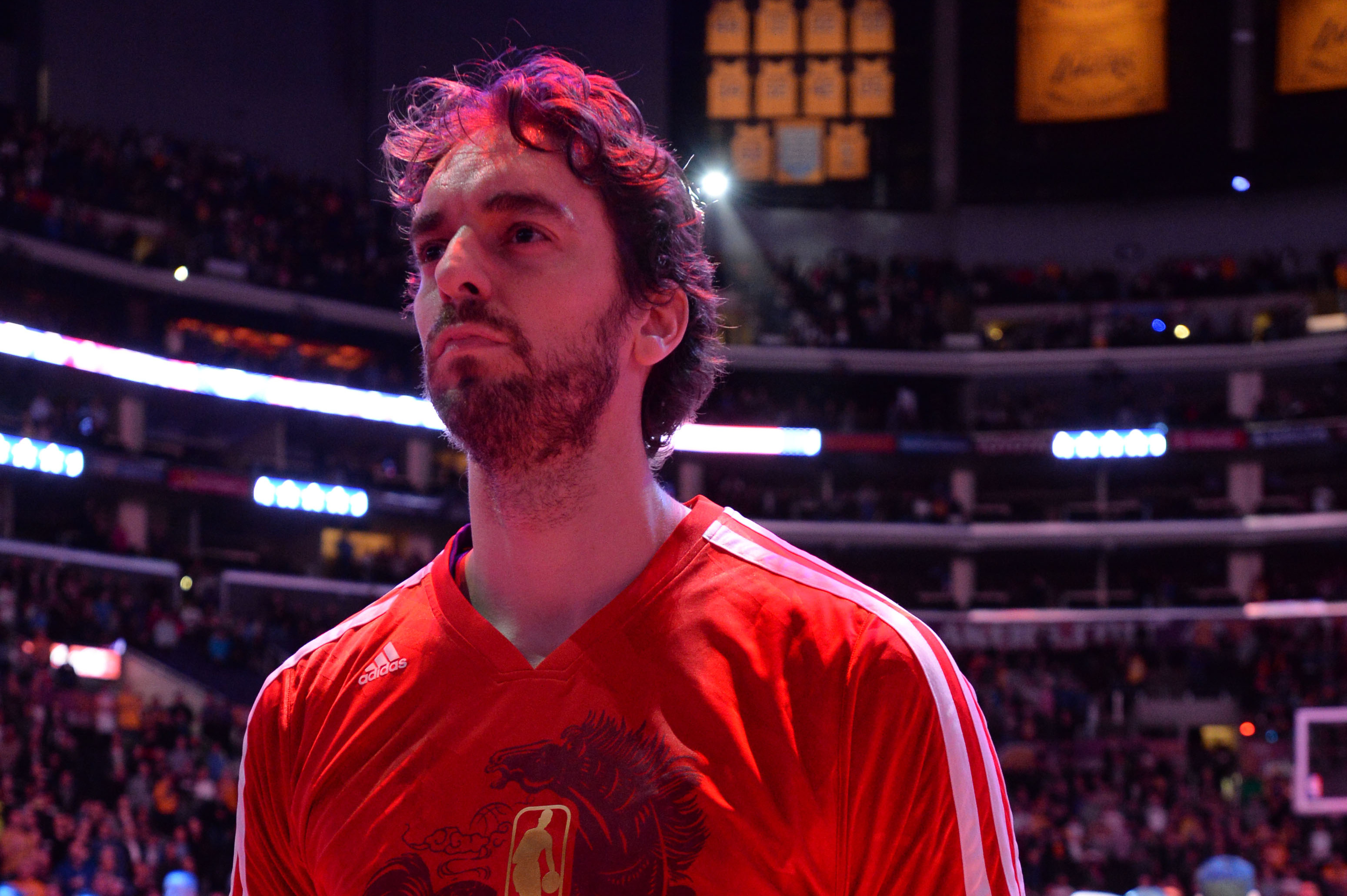 LOS ANGELES, CA - JANUARY 31: Pau Gasol #16 of the Los Angeles Lakers stands in observance of the national anthem before a game against the Charlotte Bobcats at STAPLES Center on January 31, 2014 in Los Angeles, California. NOTE TO USER: User expressly acknowledges and agrees that, by downloading and/or using this Photograph, user is consenting to the terms and conditions of the Getty Images License Agreement. Mandatory Copyright Notice: Copyright 2014 NBAE (Photo by Andrew D. Bernstein/NBAE via Getty Images)
