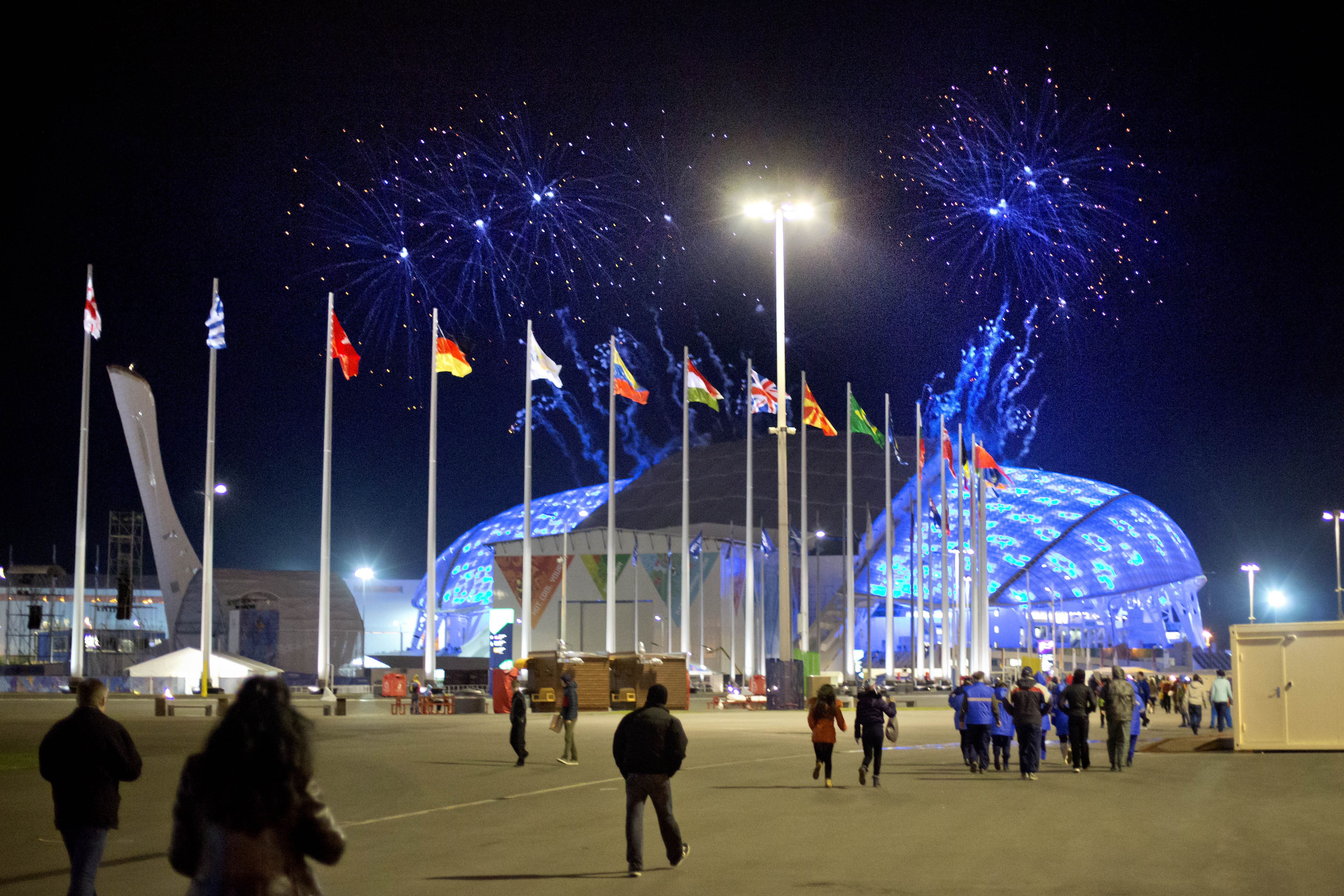 Fireworks are seen as spectators arrive for the rehearsal of the opening ceremony at the Fisht Olympic Stadium at the 2014 Winter Olympics, Saturday, Feb. 1, 2014, in Sochi, Russia. (AP Photo/David Goldman)