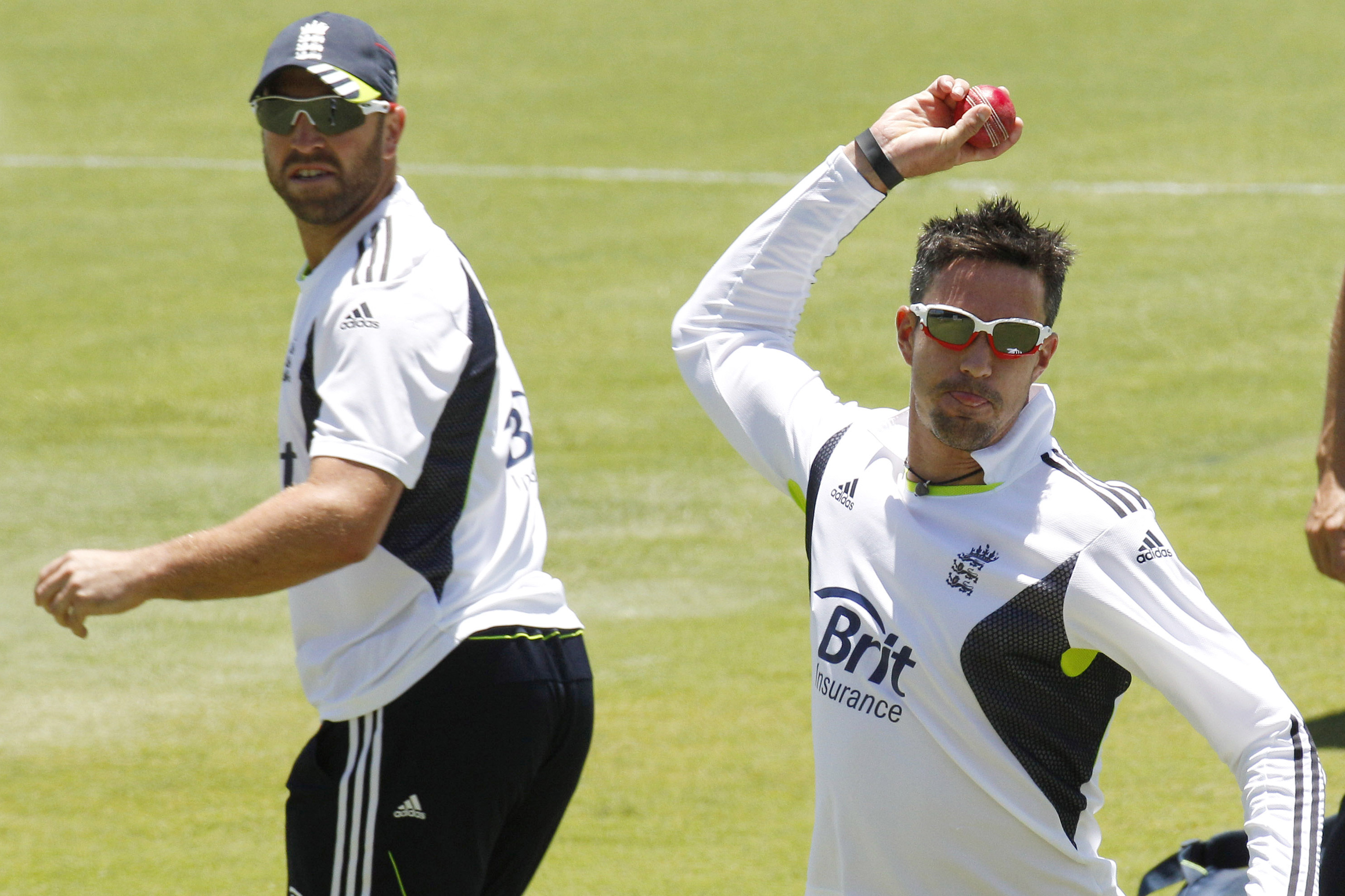 England's Matt Prior, left, looks back as Kevin Pietersen does ball skill practice during training ahead of the third Ashes cricket test against Australia in Perth, Australia, Wednesday, Dec. 15, 2010. (AP Photo/Rob Griffith)