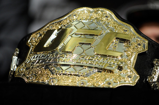 The UFC Championship belt is displayed during the news conference after the UFC 162 mixed martial arts bouts Saturday, July 6, 2013, in Las Vegas.  (AP Photo/David Becker)