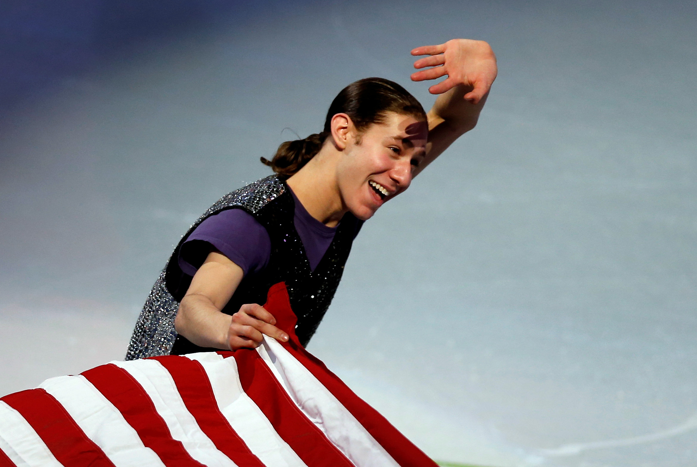 Jan 12, 2014; Boston, MA, USA; Jason Brown holds an American flag during the skating spectacular exhibition event in the U.S. Figure Skating Championships at TD Garden. Mandatory Credit: Greg M. Cooper-USA TODAY Sports