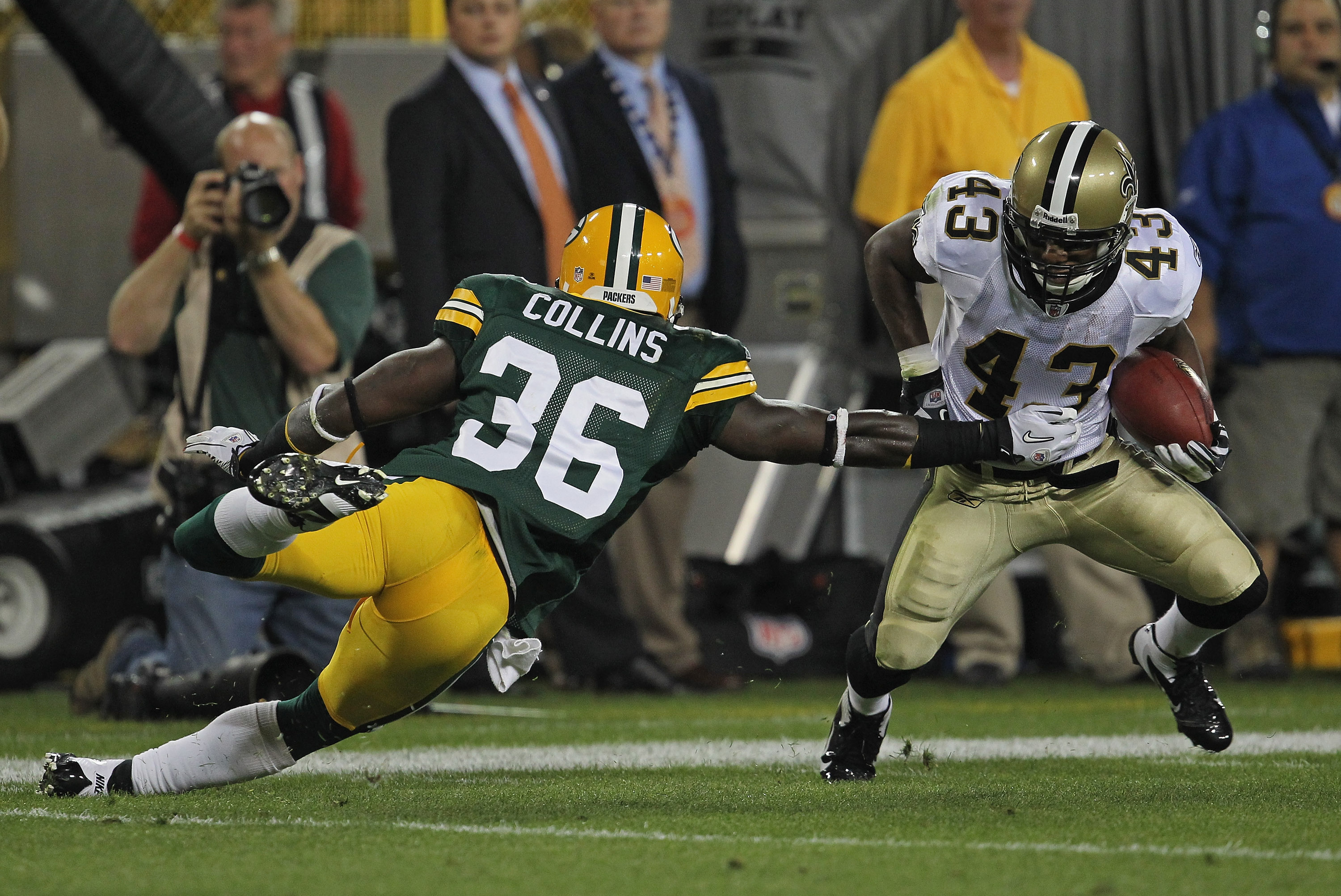 GREEN BAY, WI - SEPTEMBER 08:  Darren Sproles #43 of the New Orleans Saints tries to move around Nick Collins #36 of the Green Bay Packers during the NFL opening season game at Lambeau Field on September 8, 2011 in Green Bay, Wisconsin. The Packers defeated the Saints 42-34.  (Photo by Jonathan Daniel/Getty Images)